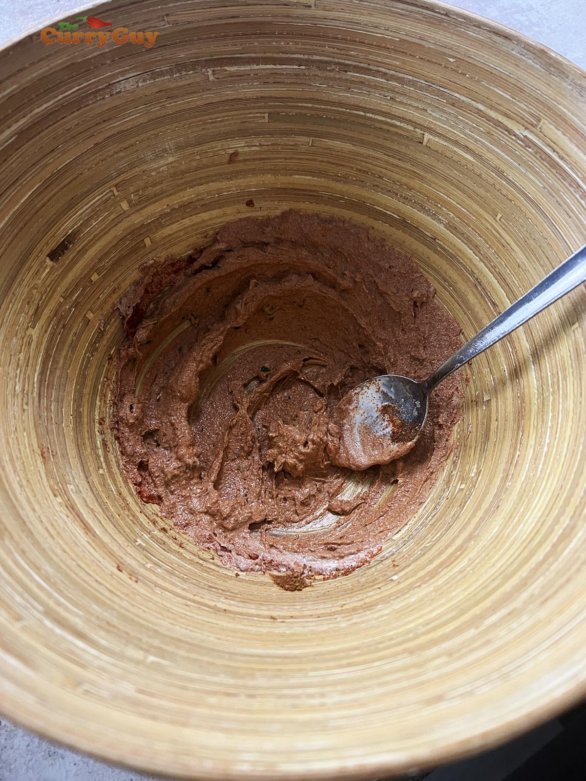 Whisking the second marinade ingredients together