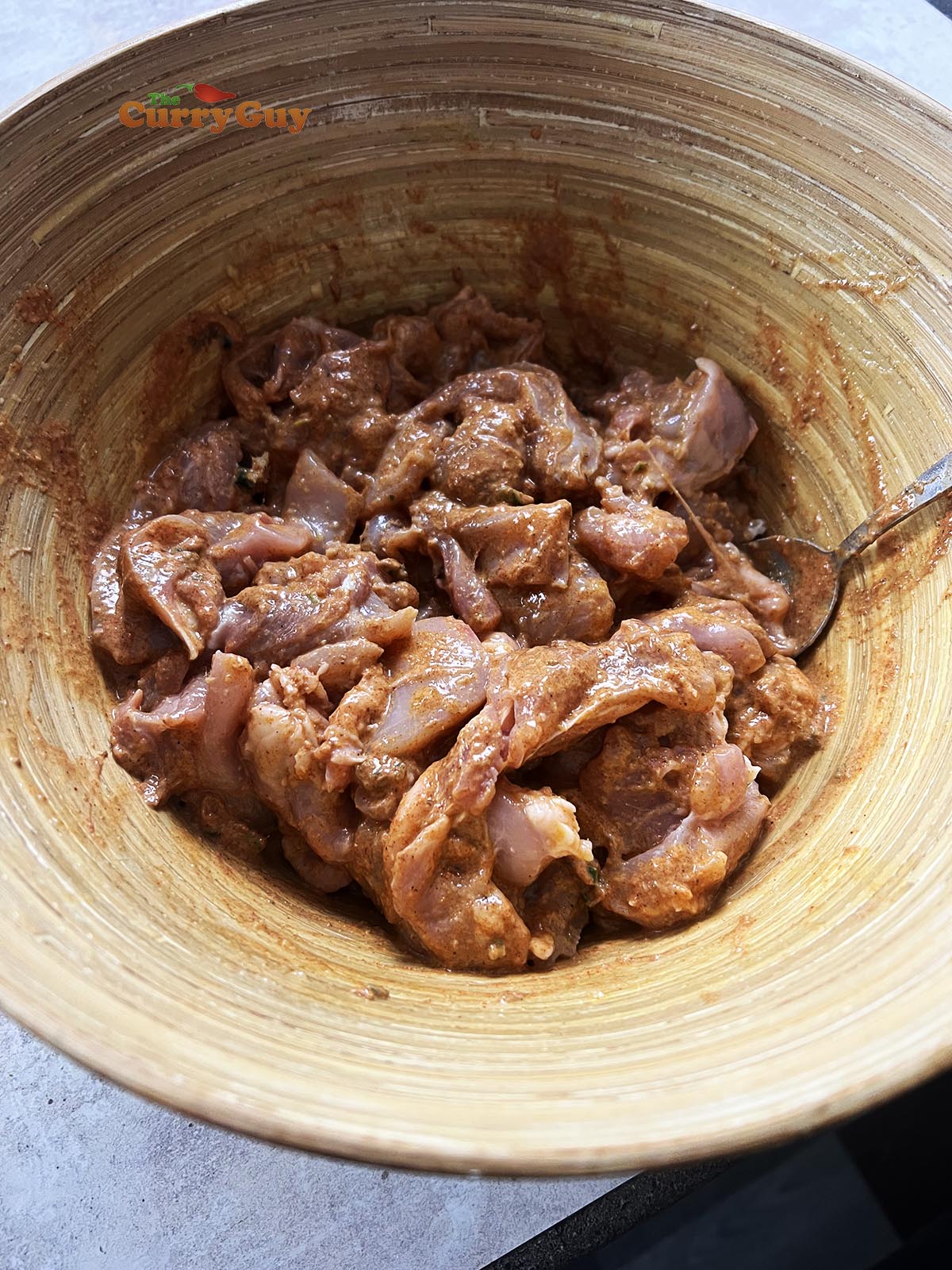 Adding second marinade to the chicken.
