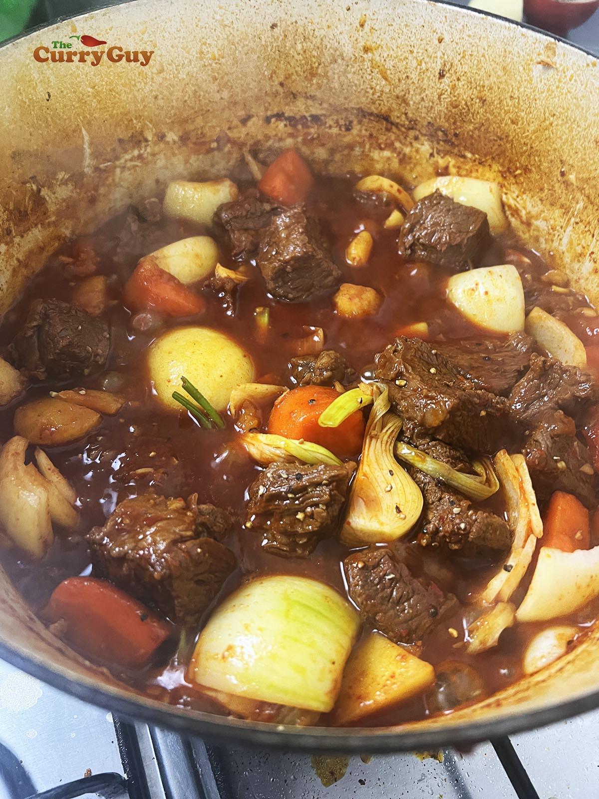 Adding the onion petals and spring onions.