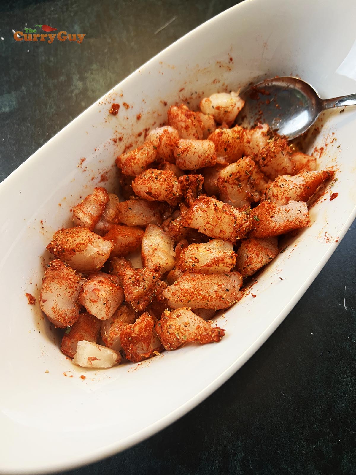Prawns marinating in Cajun spices.