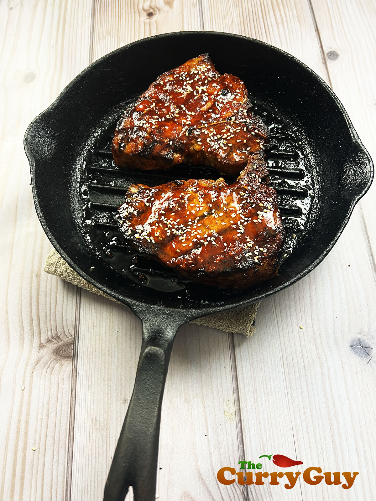 The finished pork chops in pan