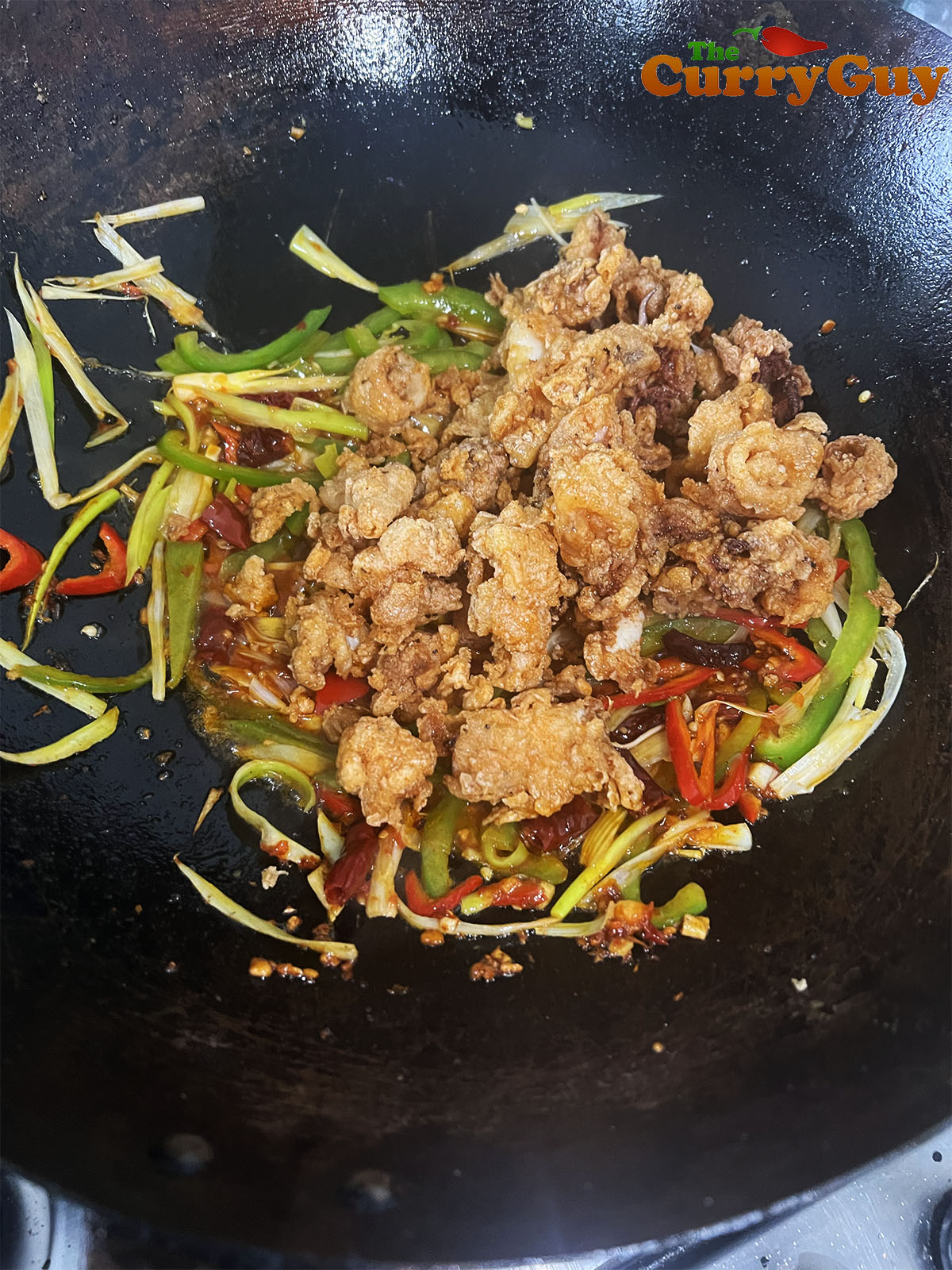 Tossing in the calamari.