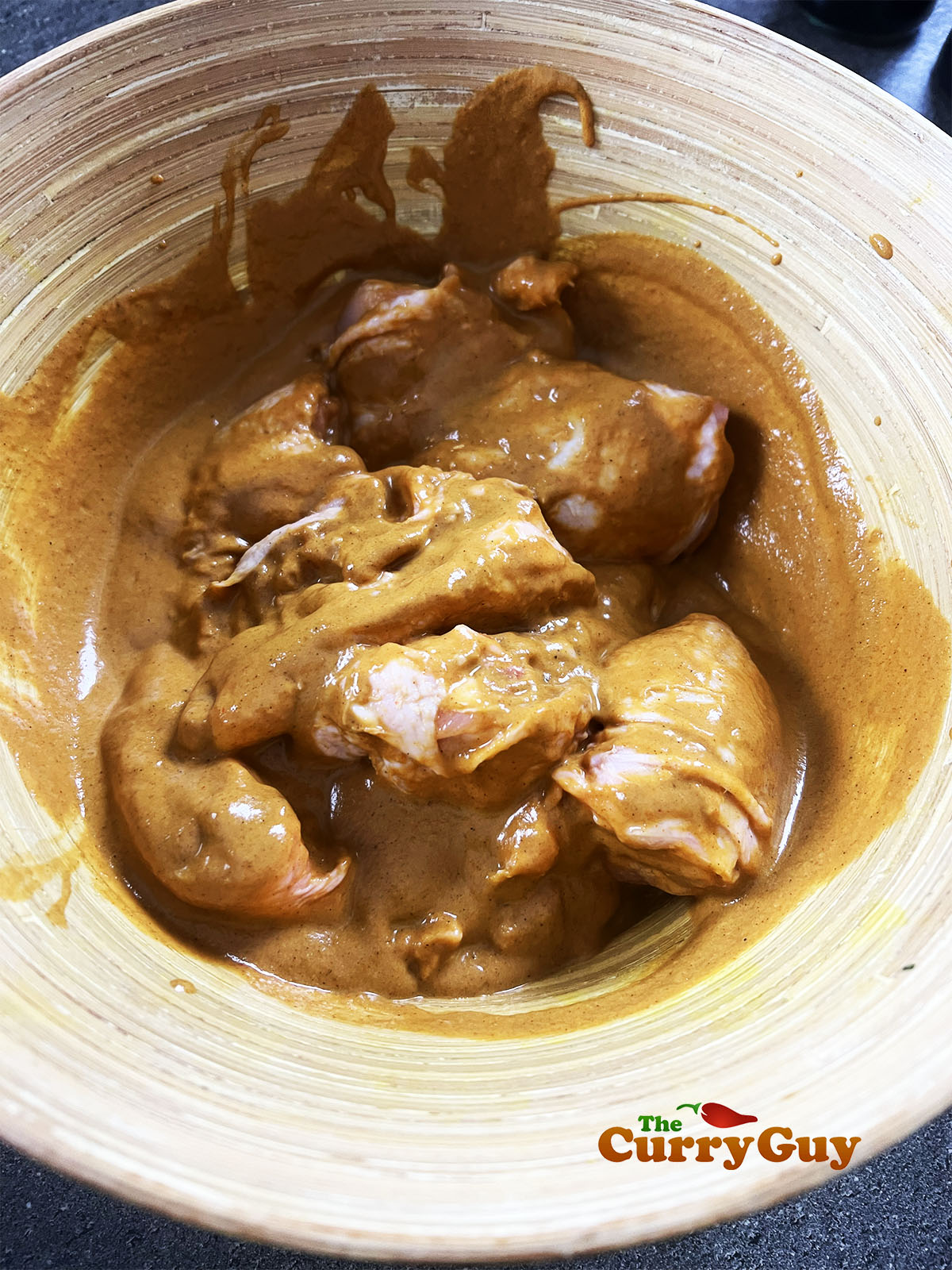 Mixing marinade into chicken