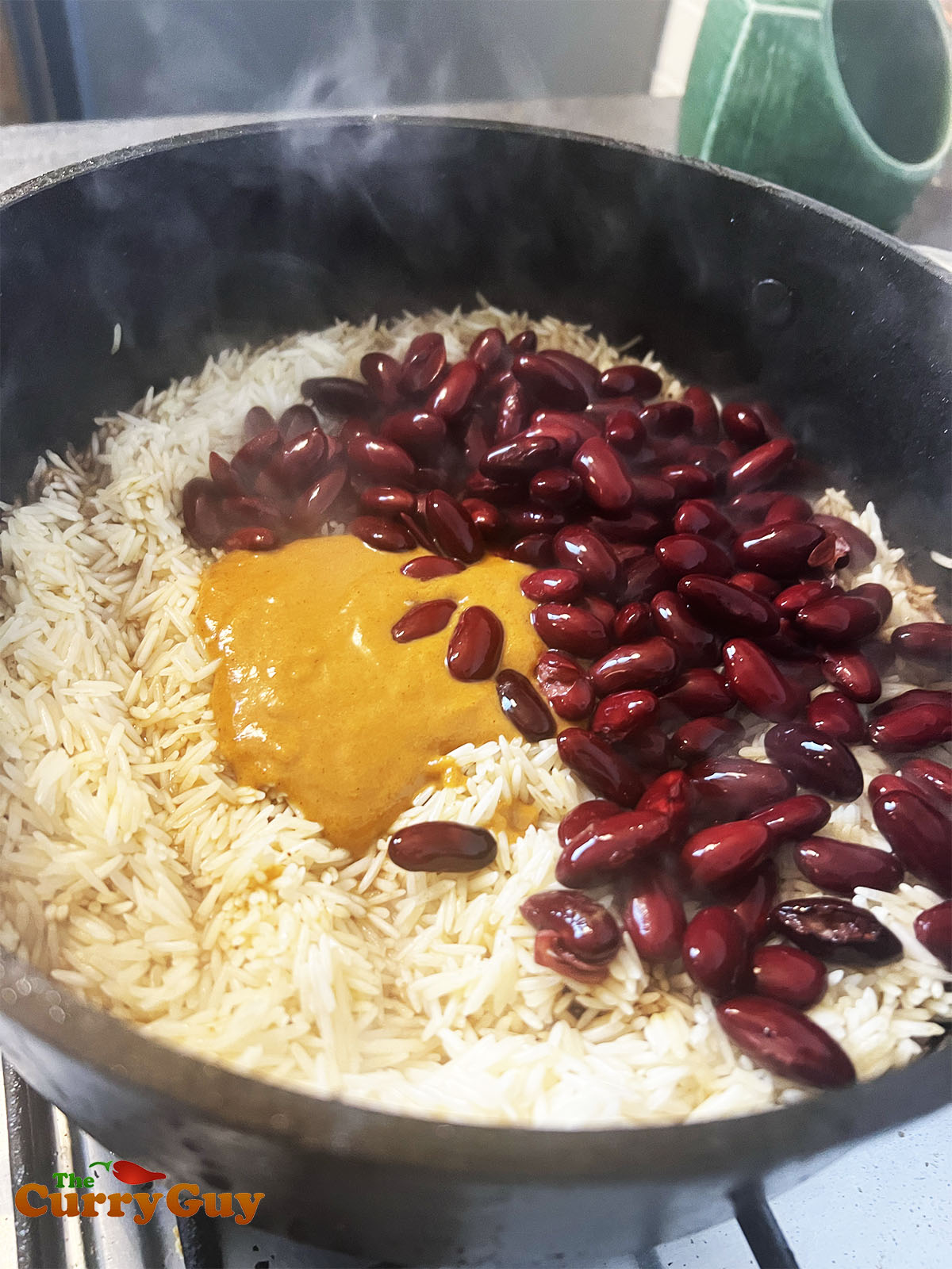Beans,rice and marinade being added.