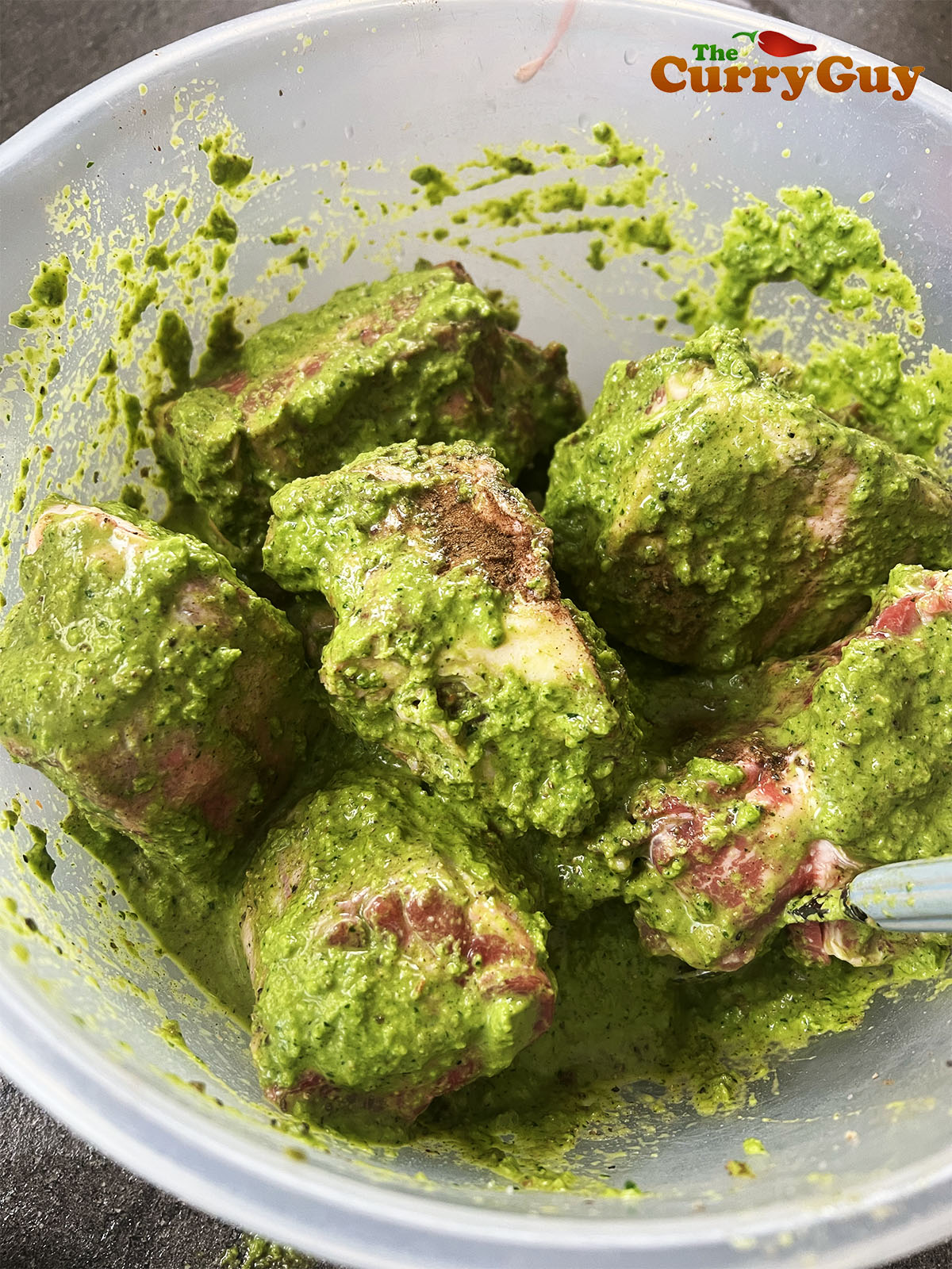 Marinating the oxtail in the dry and wet marinades.