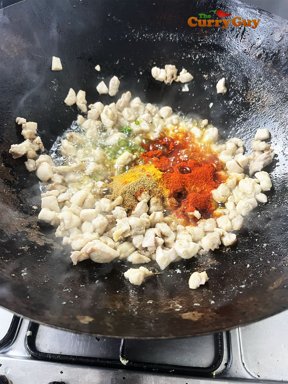 Adding ground spices to the pan