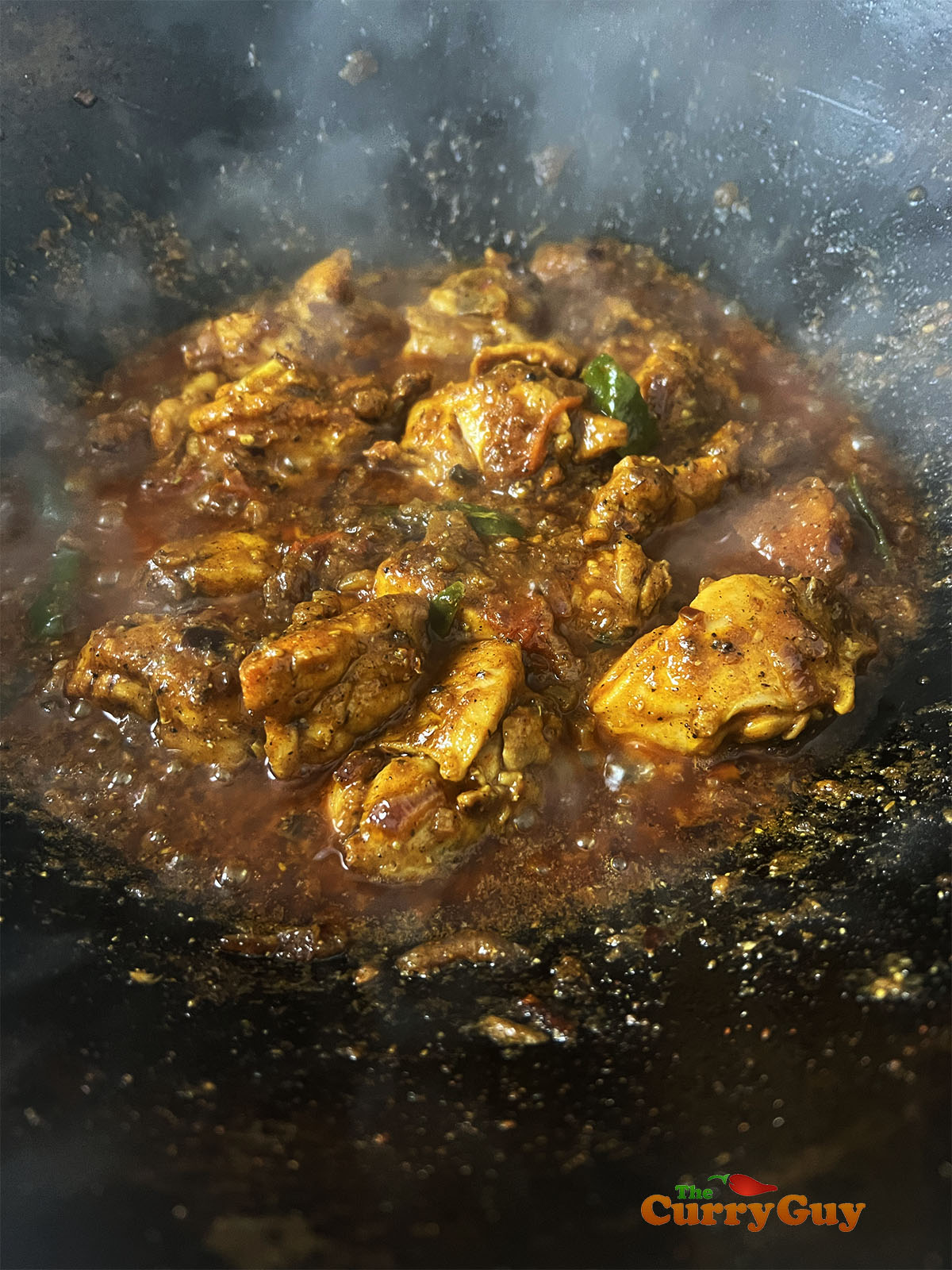 Returning the chicken to the pan