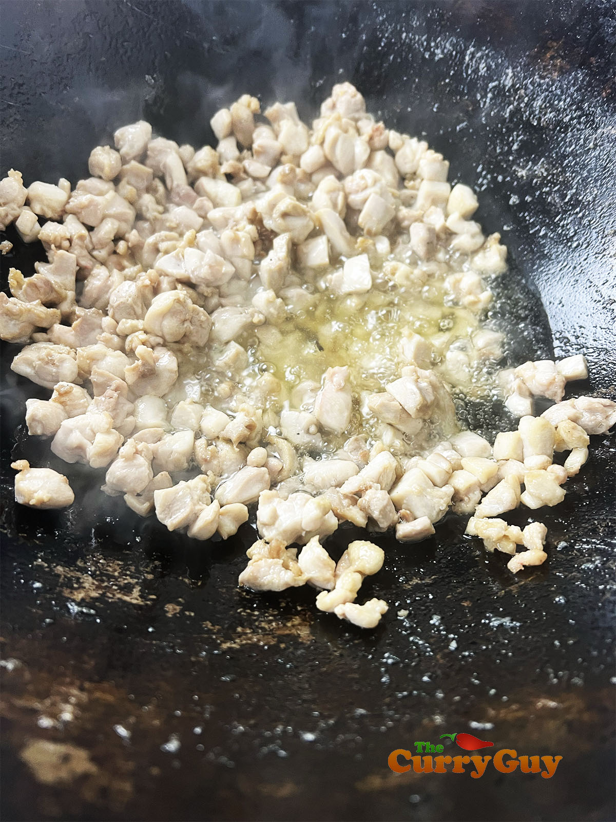 Frying the chicken keema