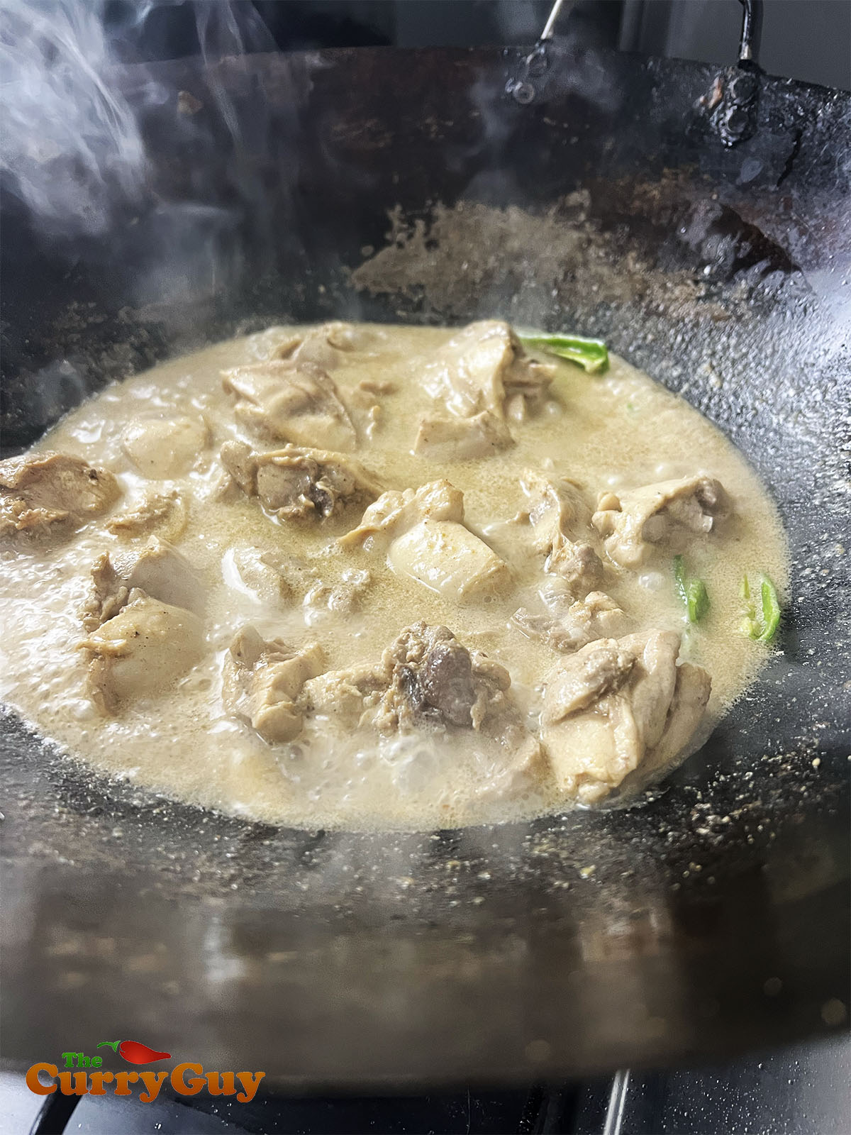 Adding chillies to the pan