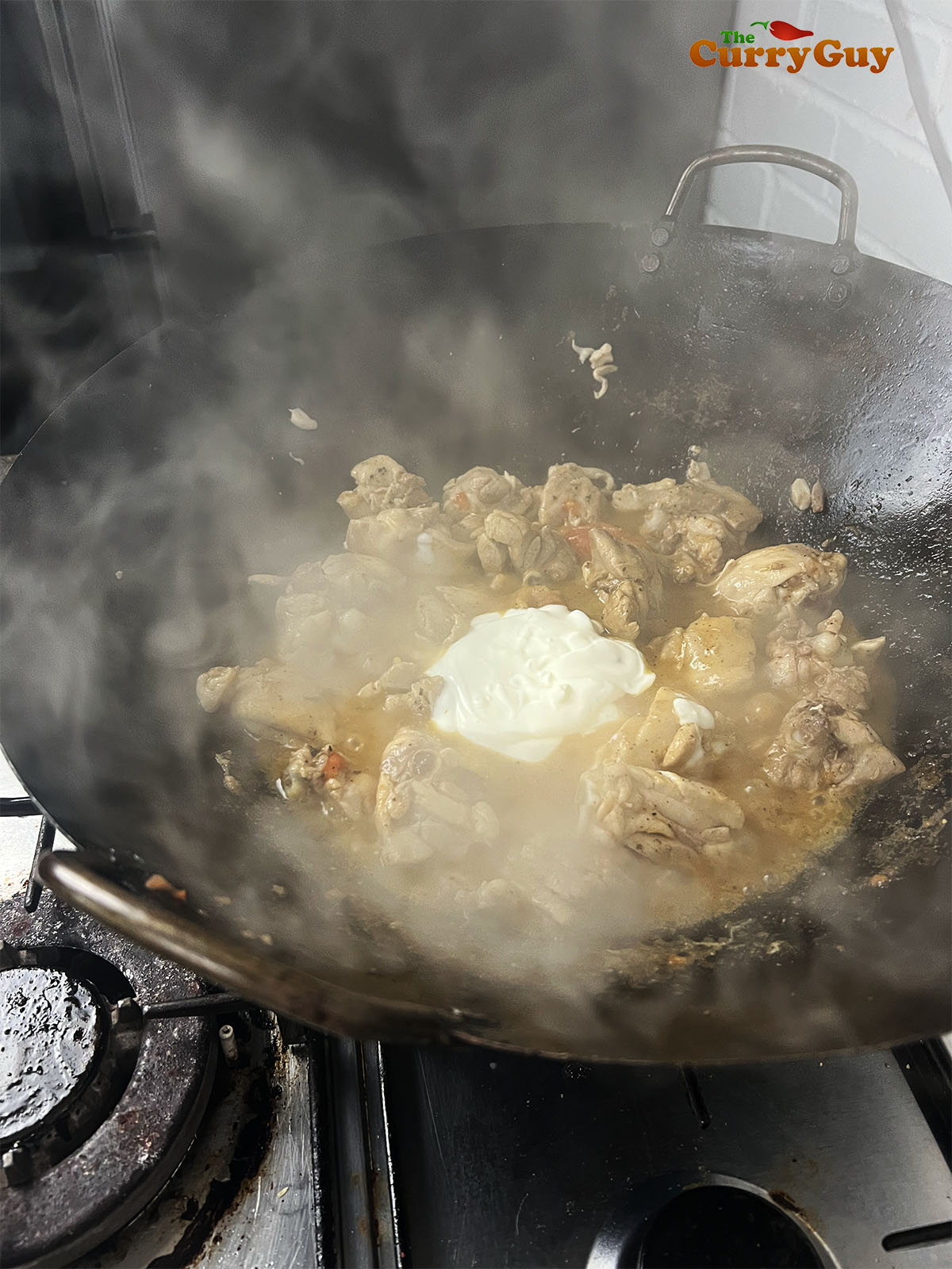 Adding the yoghurt to the pan