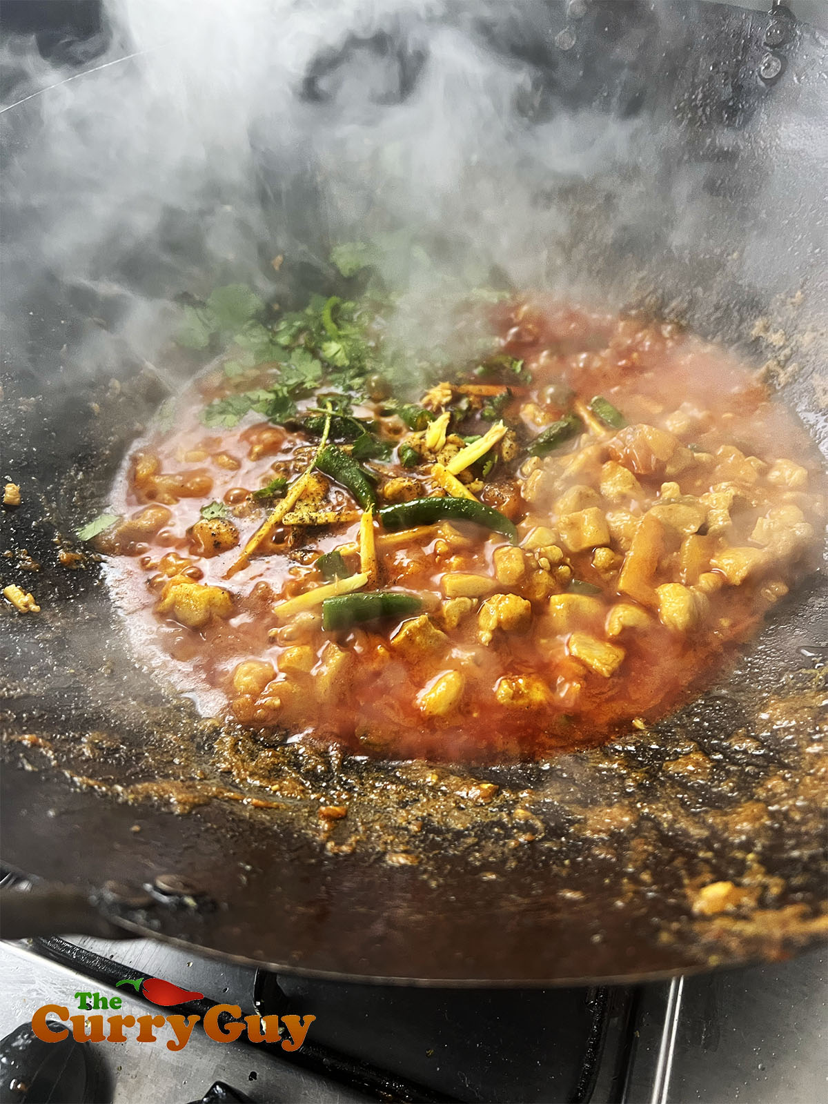 The reduced tomato sauce for the chicken keema