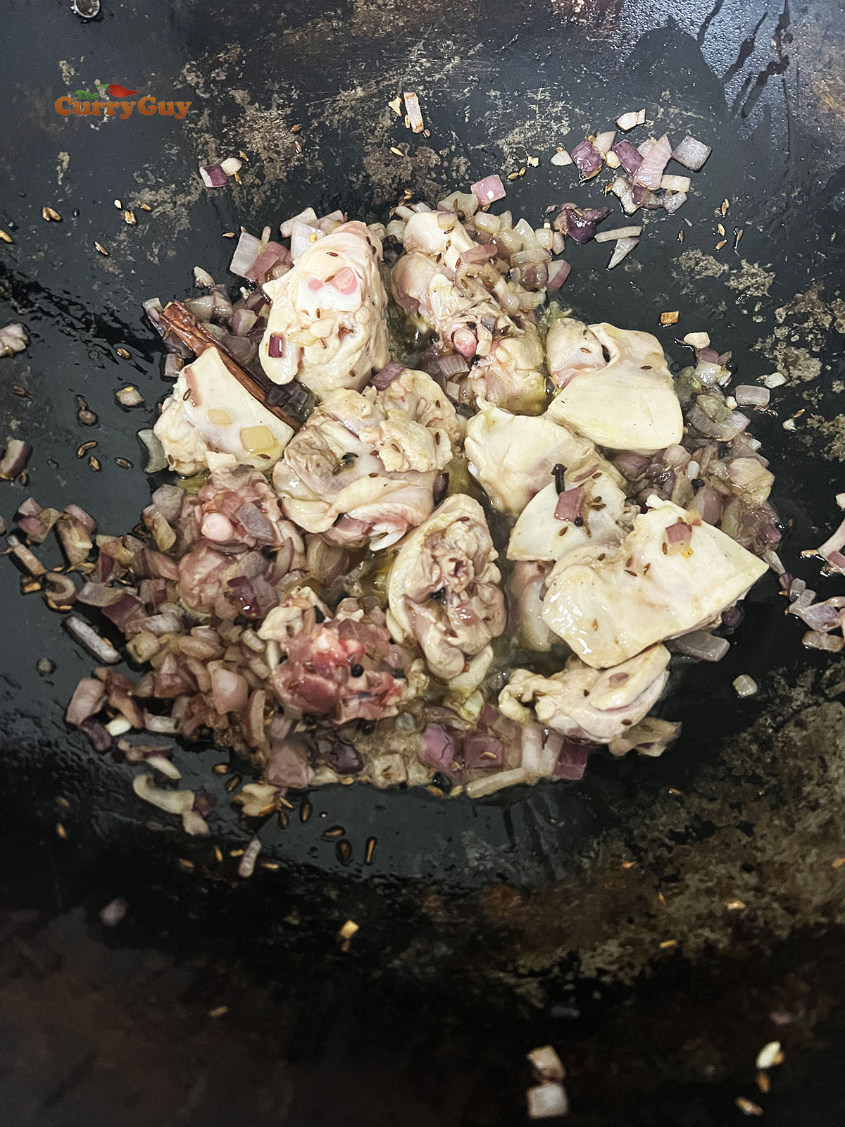 Stirring in the garlic and ginger paste.