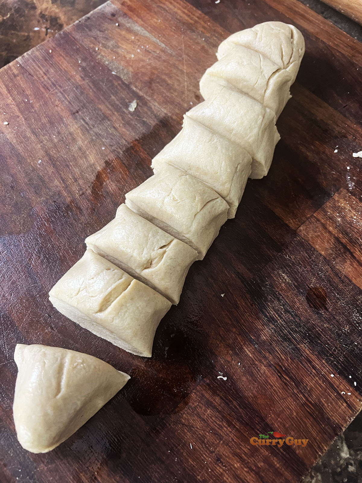 Rolled dough into a long rope shape.