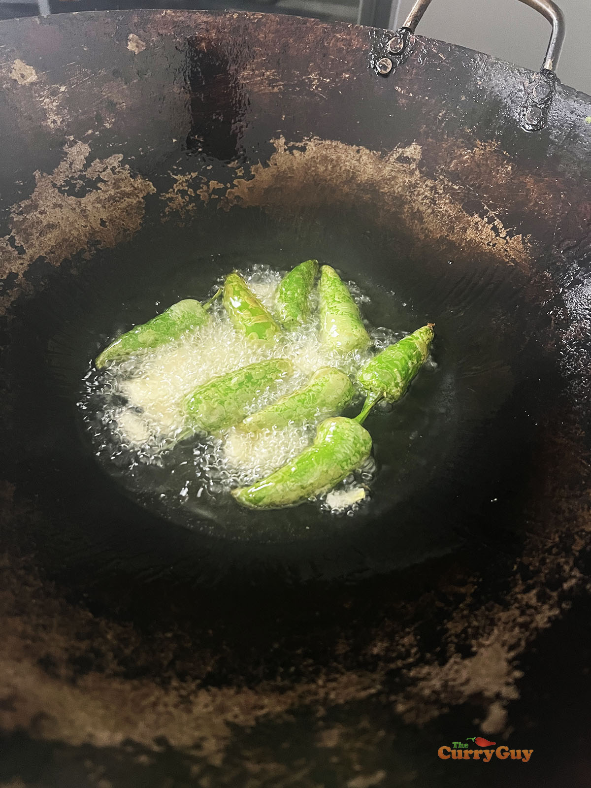 Frying the chillies and garlic