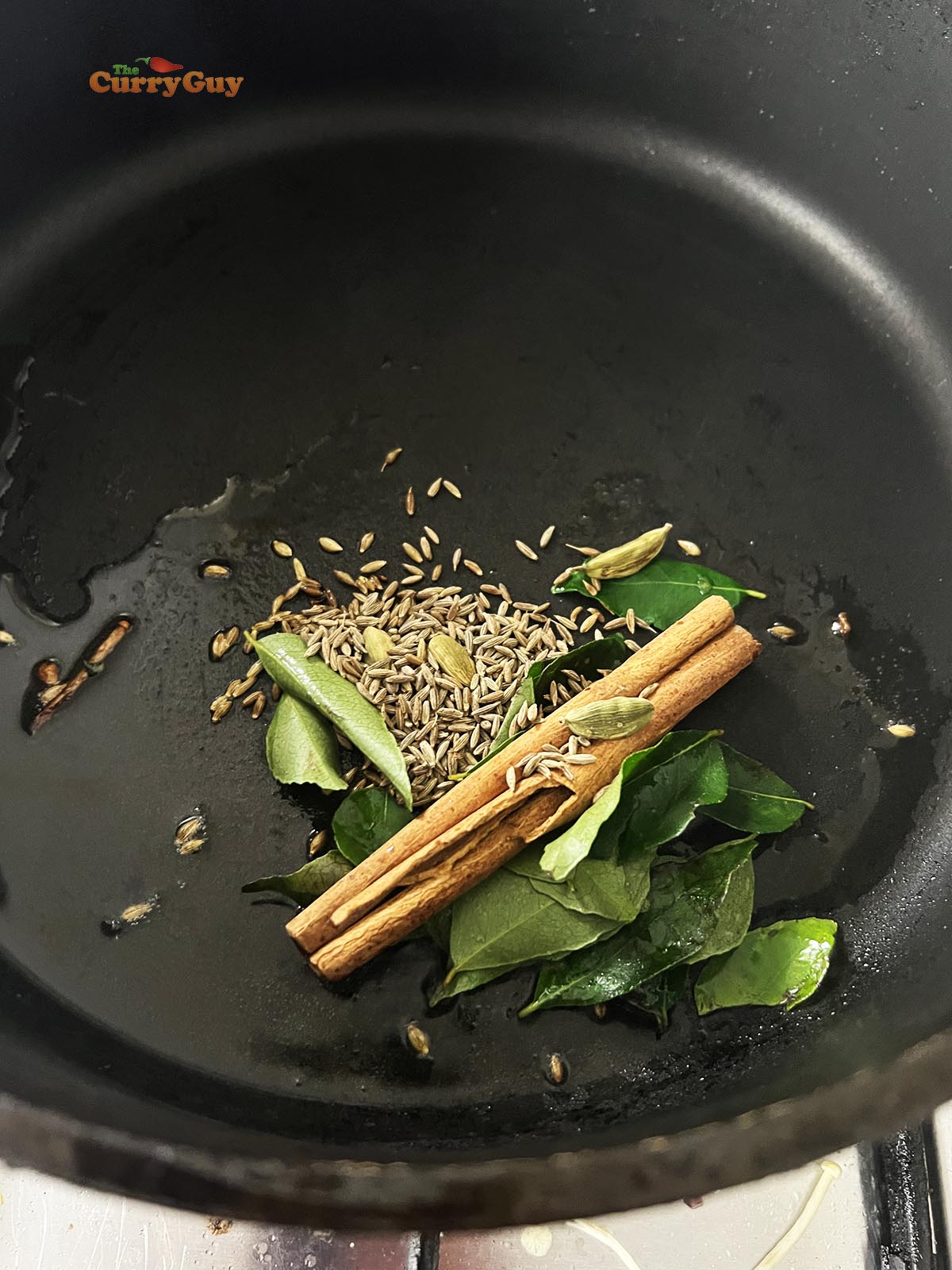 Infusing the whole spices in oil.