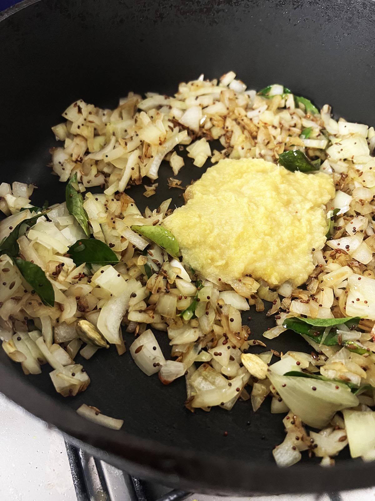 Stirring in the garlic and ginger paste.