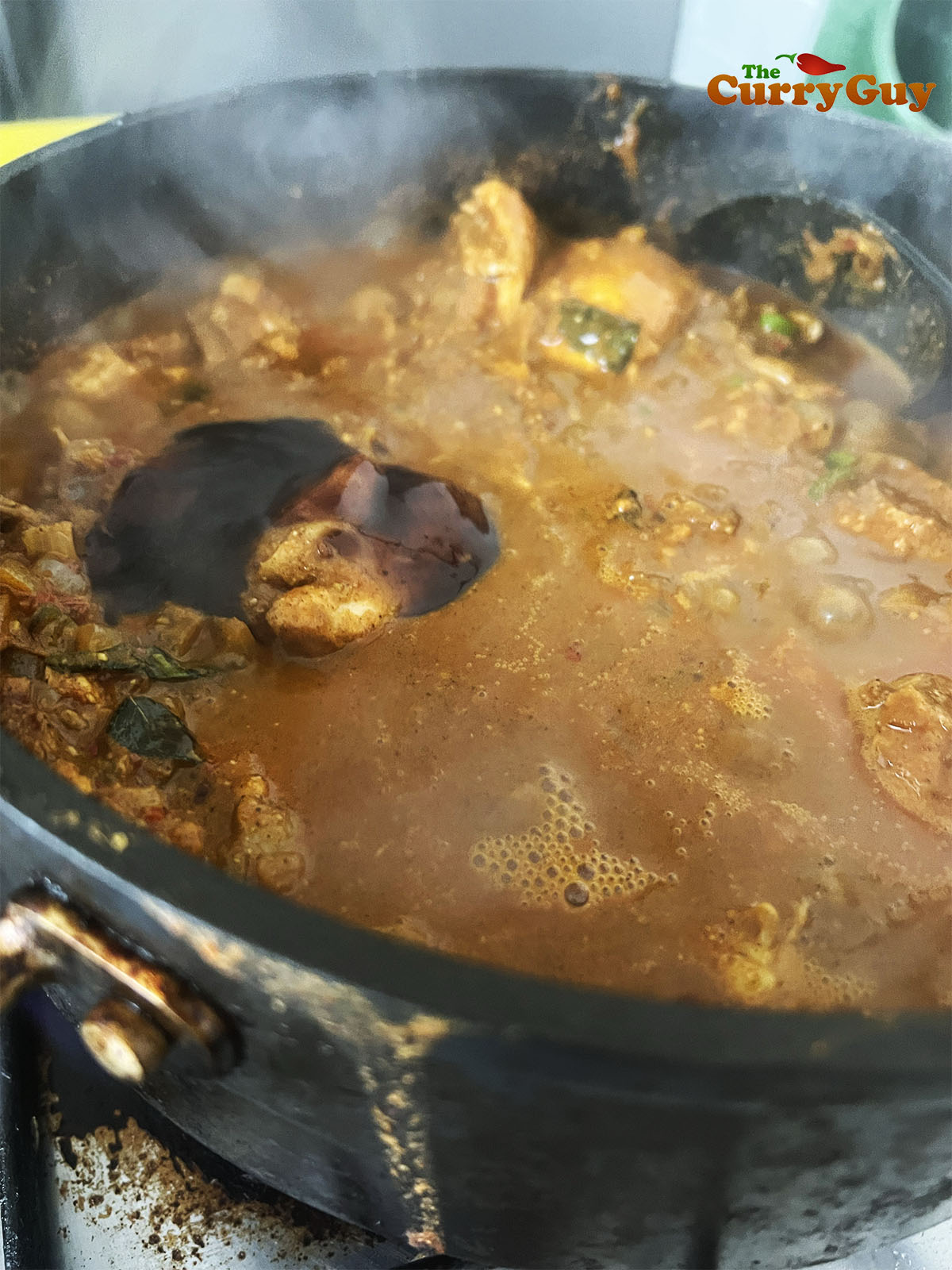 Adding tamarind and chopped coriander.