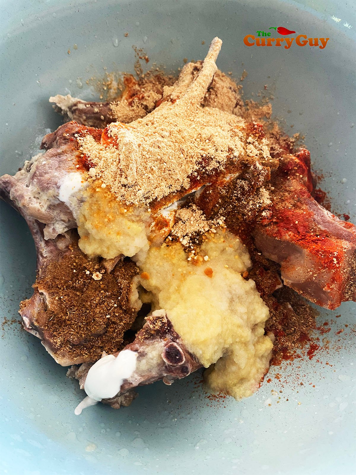 Marinating the lamb chops.