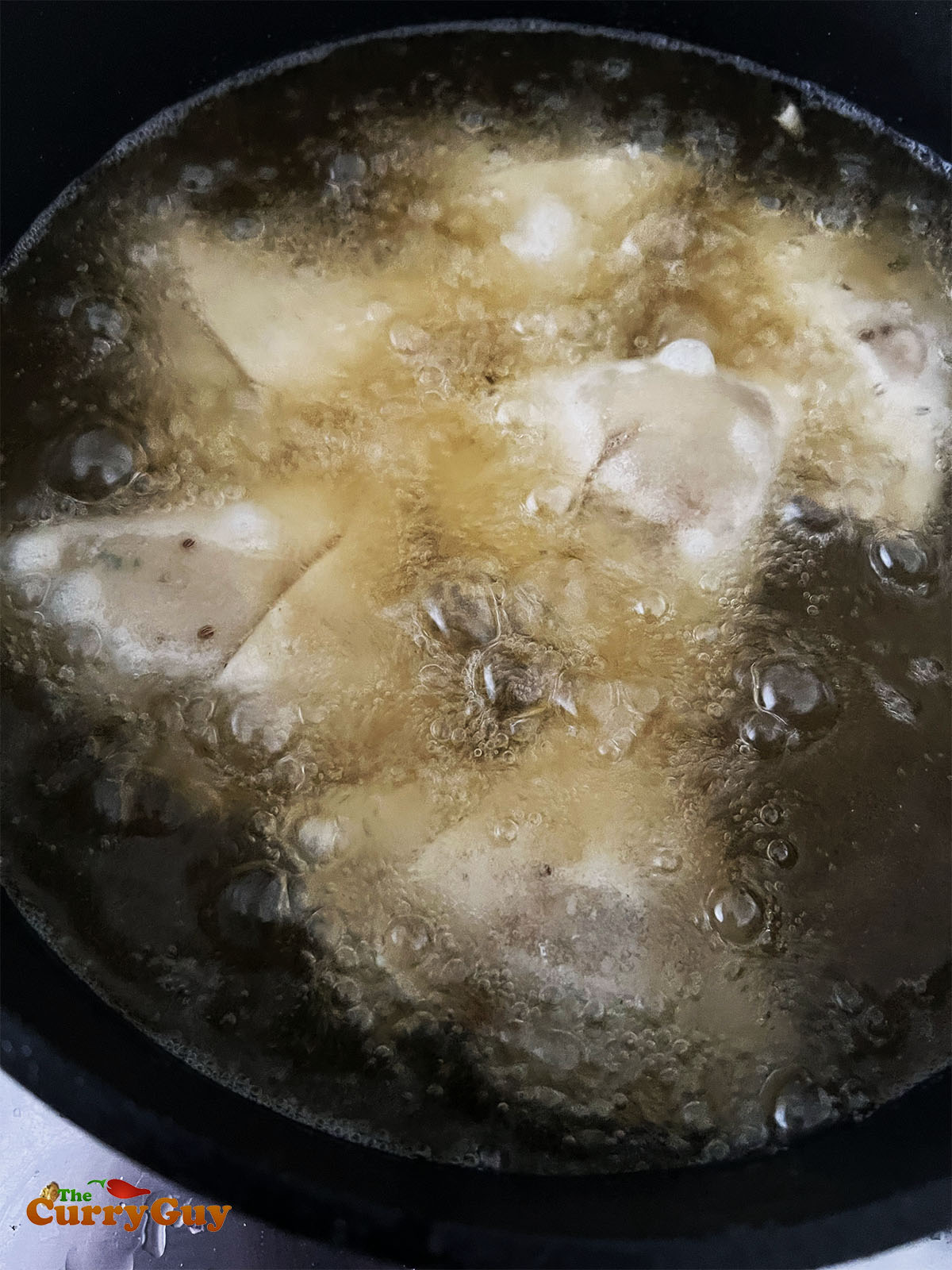 Frying the samosas