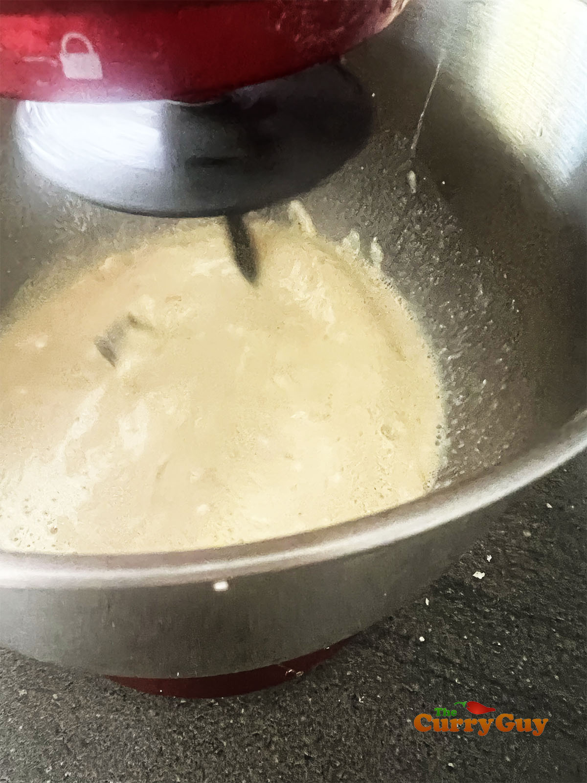 Stirring the wet and dry ingredients together.