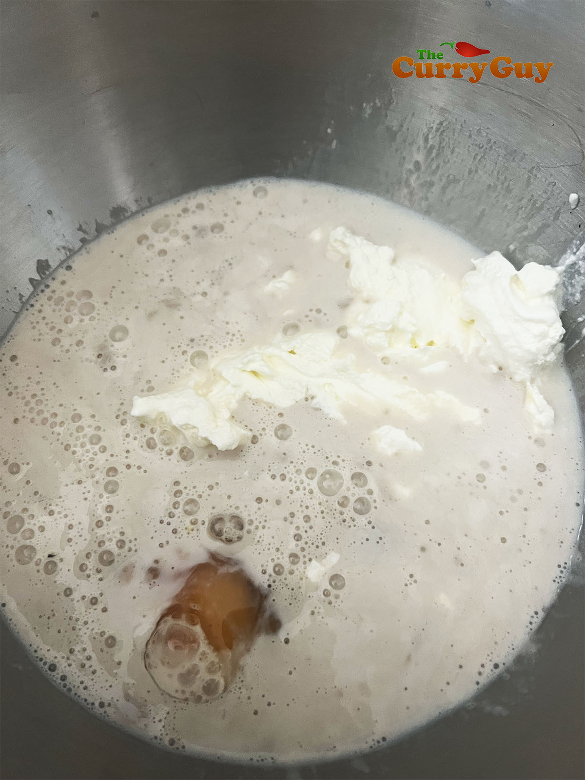 Frothy yeast in milk.