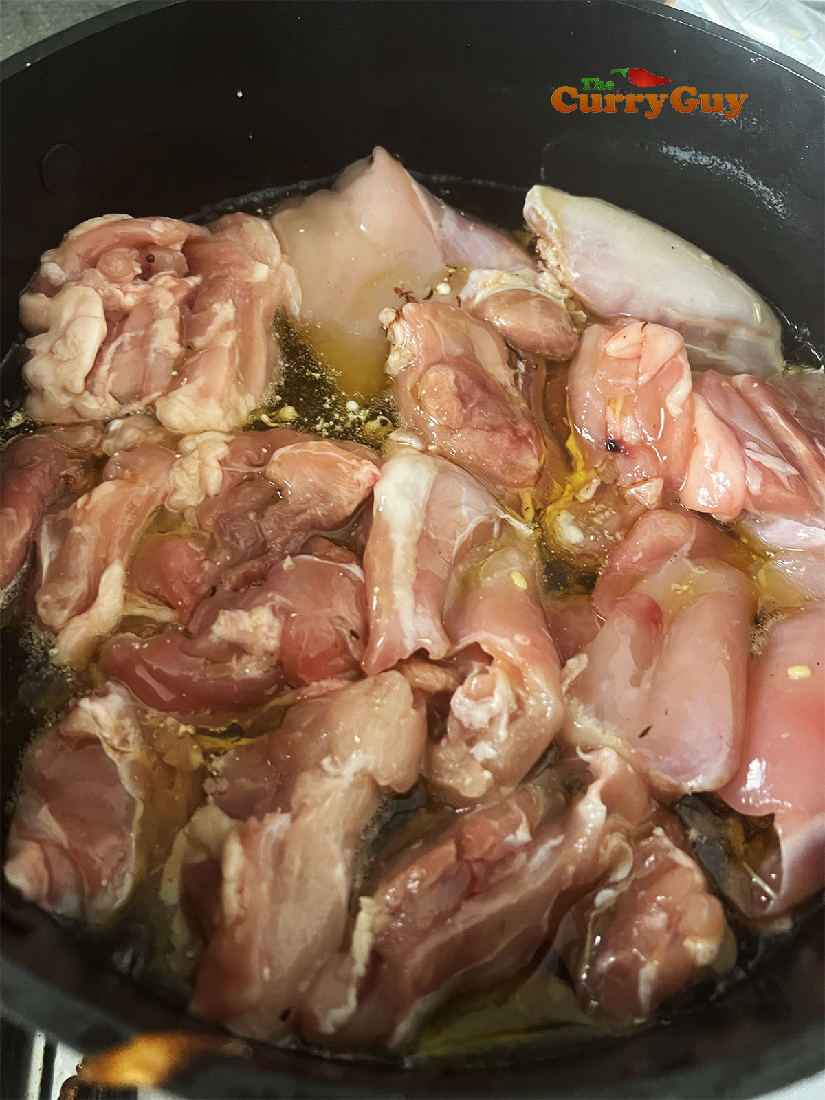 Cooking the chicken in the ghee.