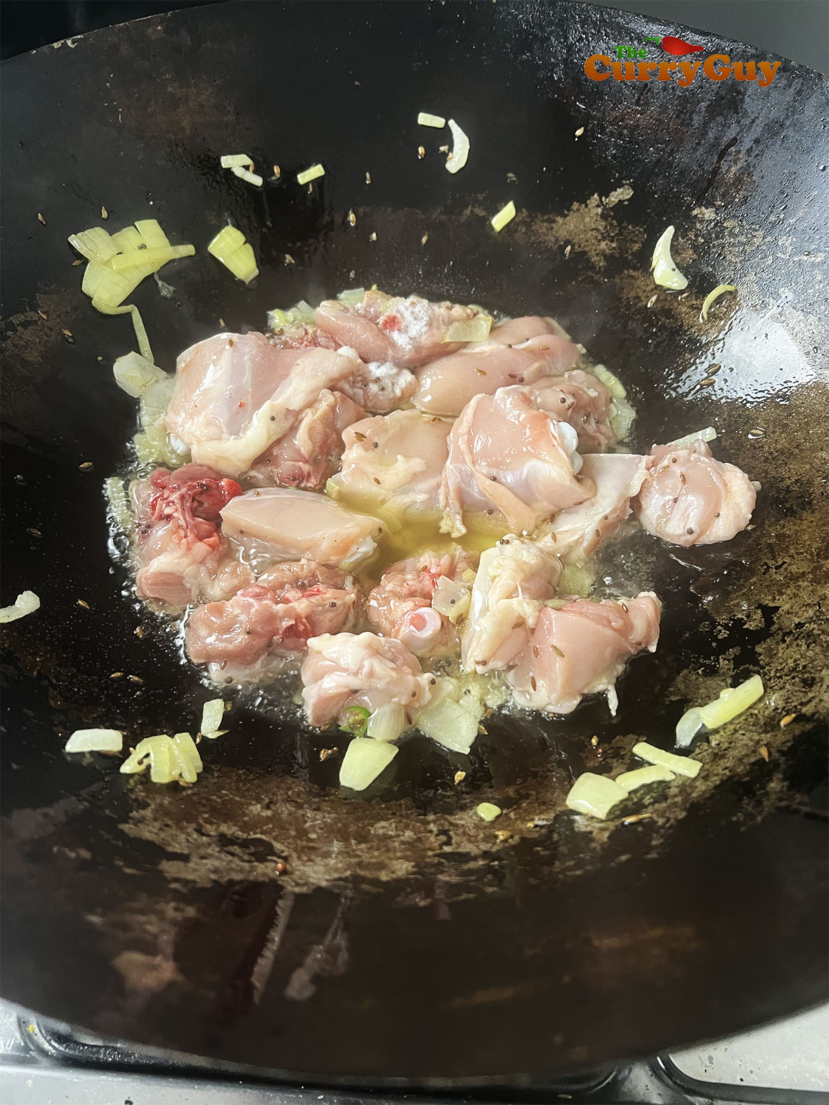 Adding the chicken to the hot oil