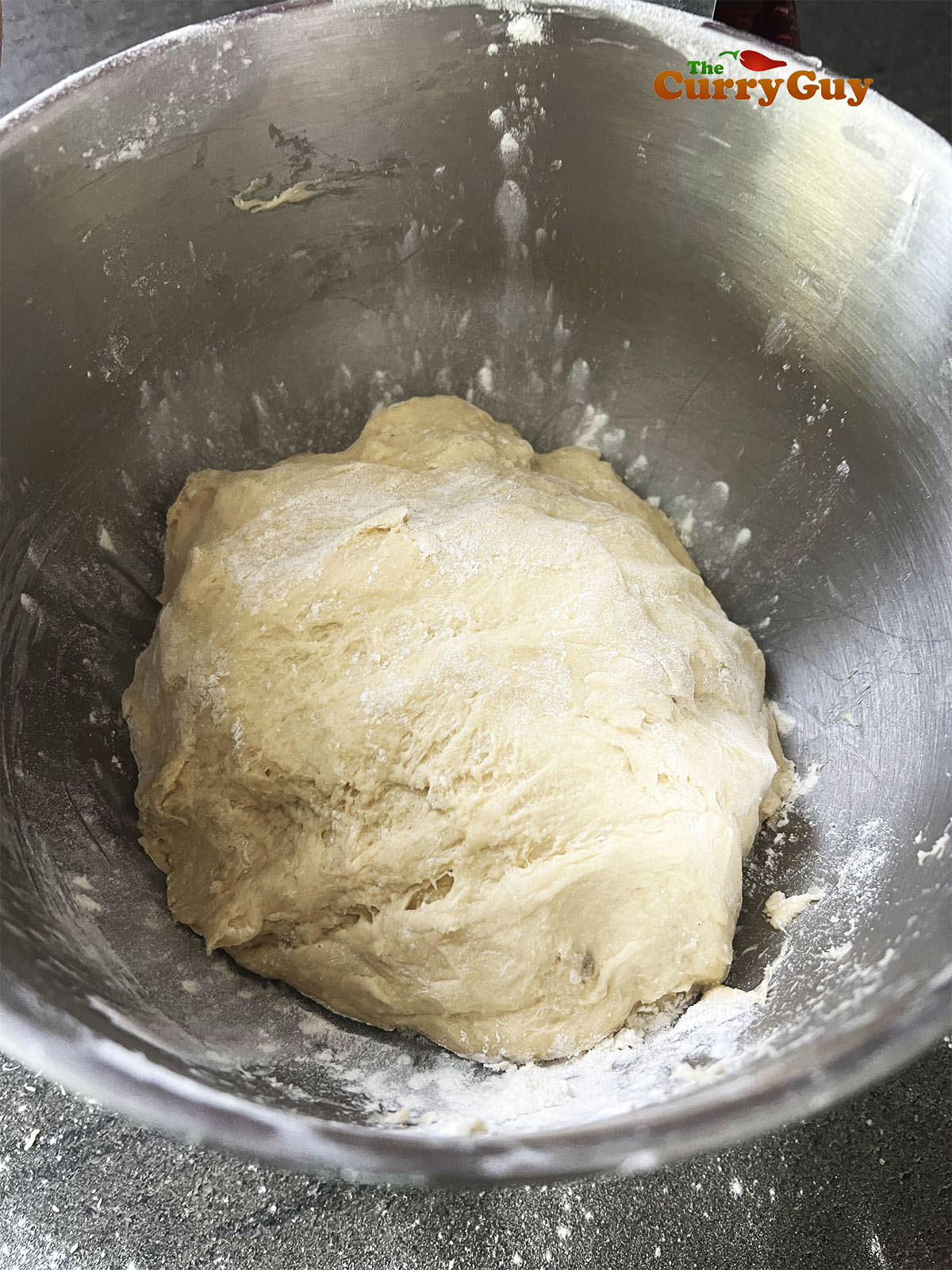 Dough in mixing bowl.