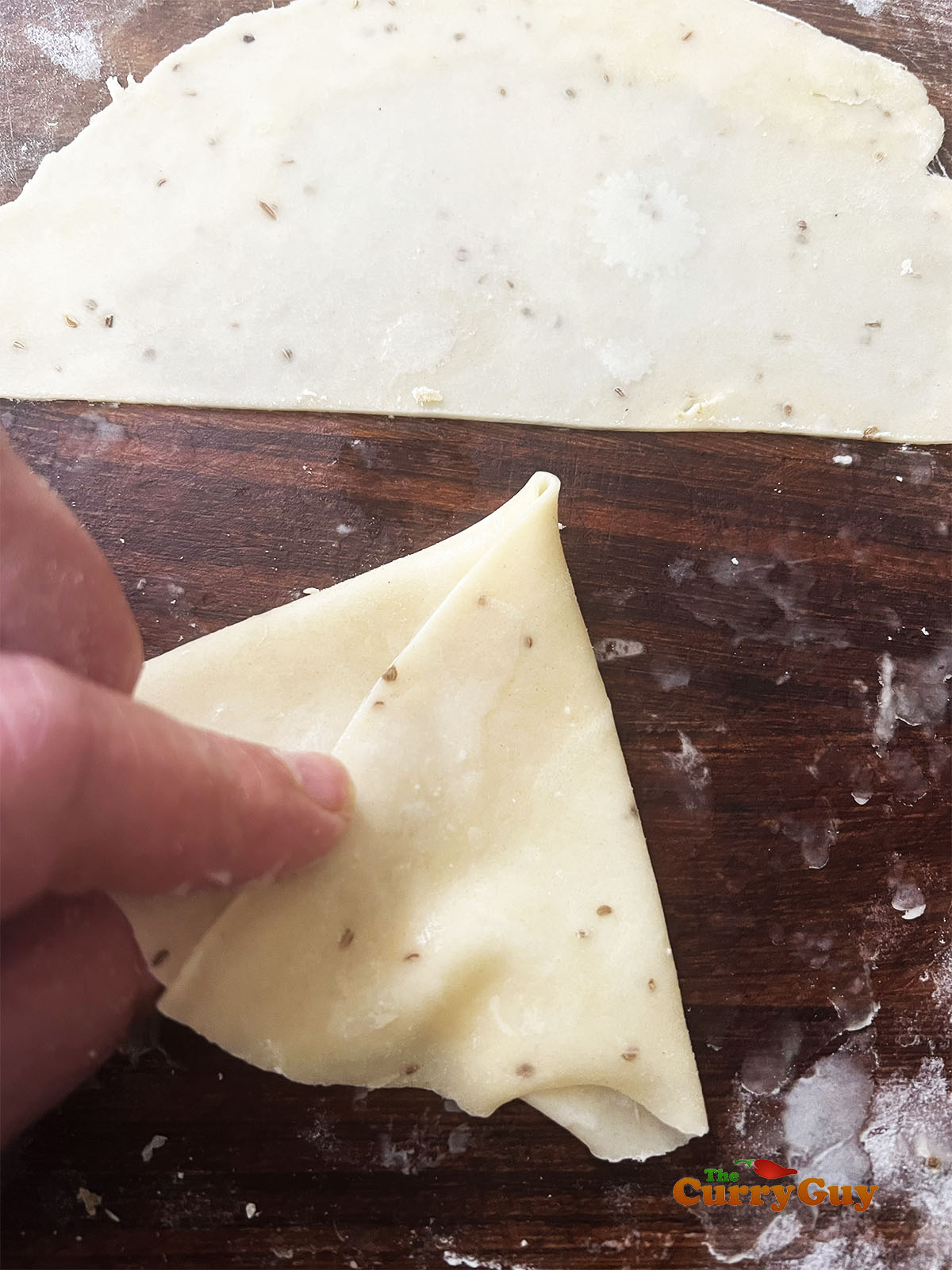 Folding a samosa