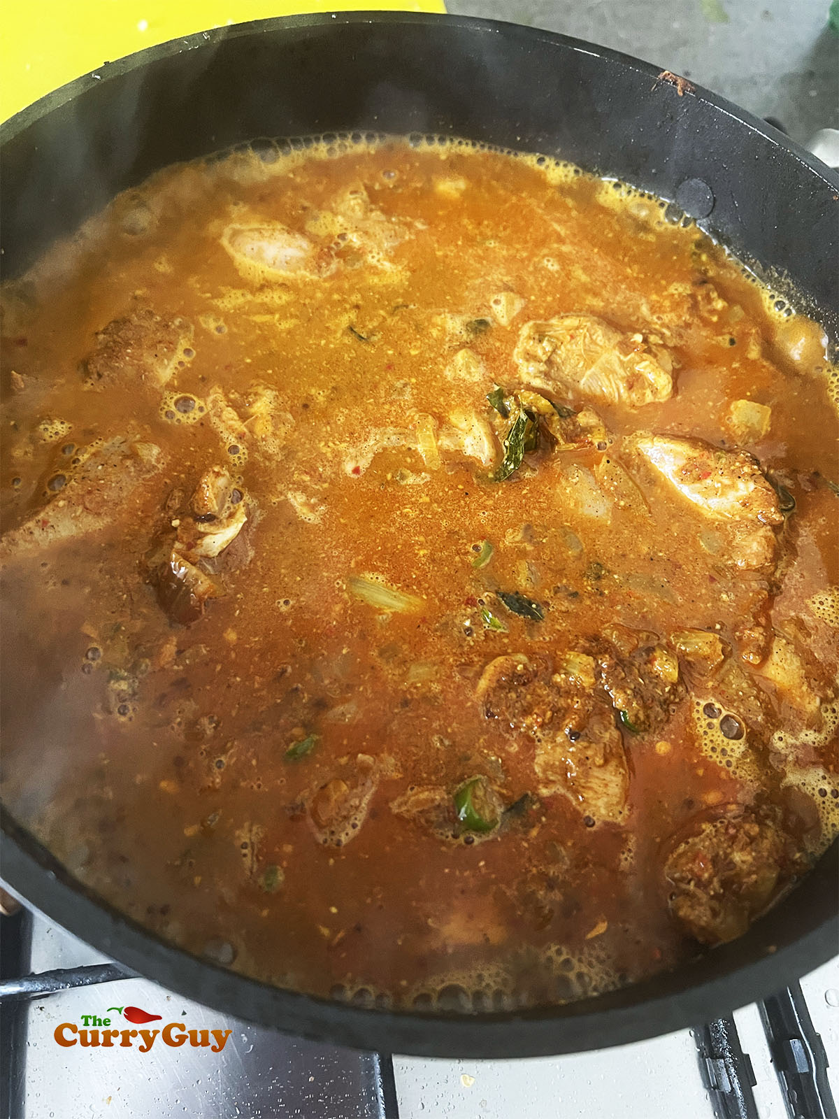 Adding the chicken and water or stock