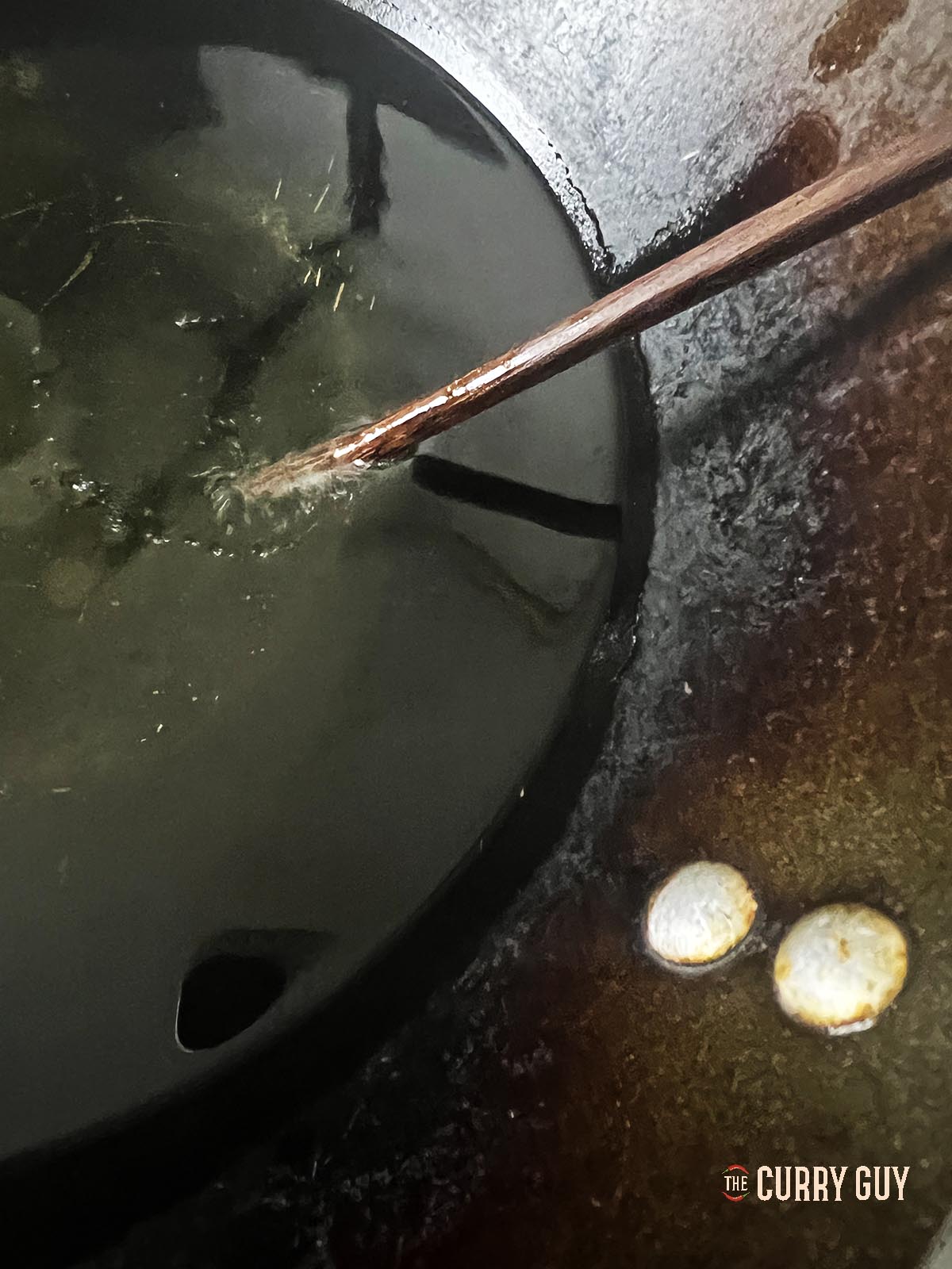 Checking the oil heat for frying.