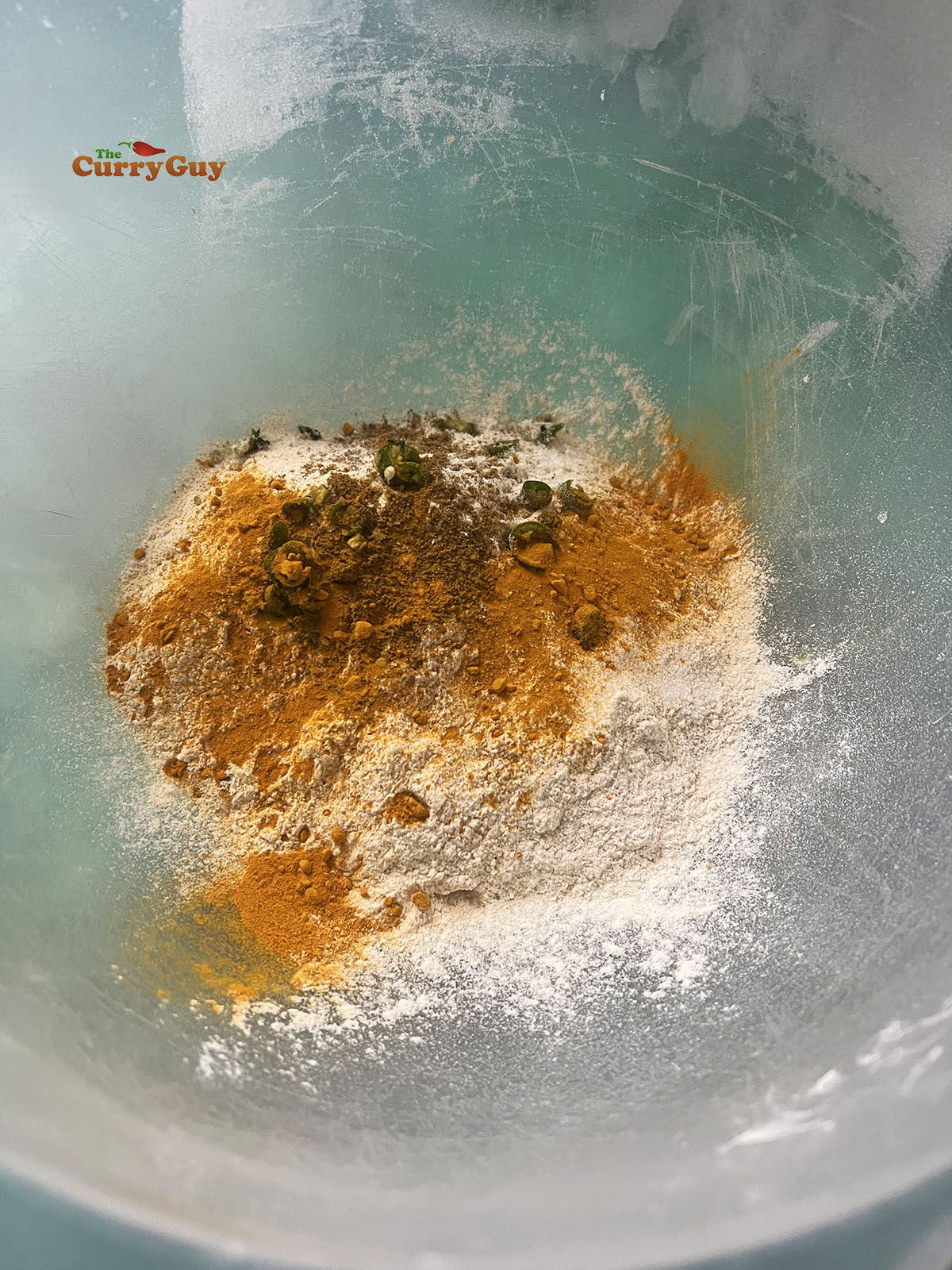 Flour and spices in a mixing bowl.