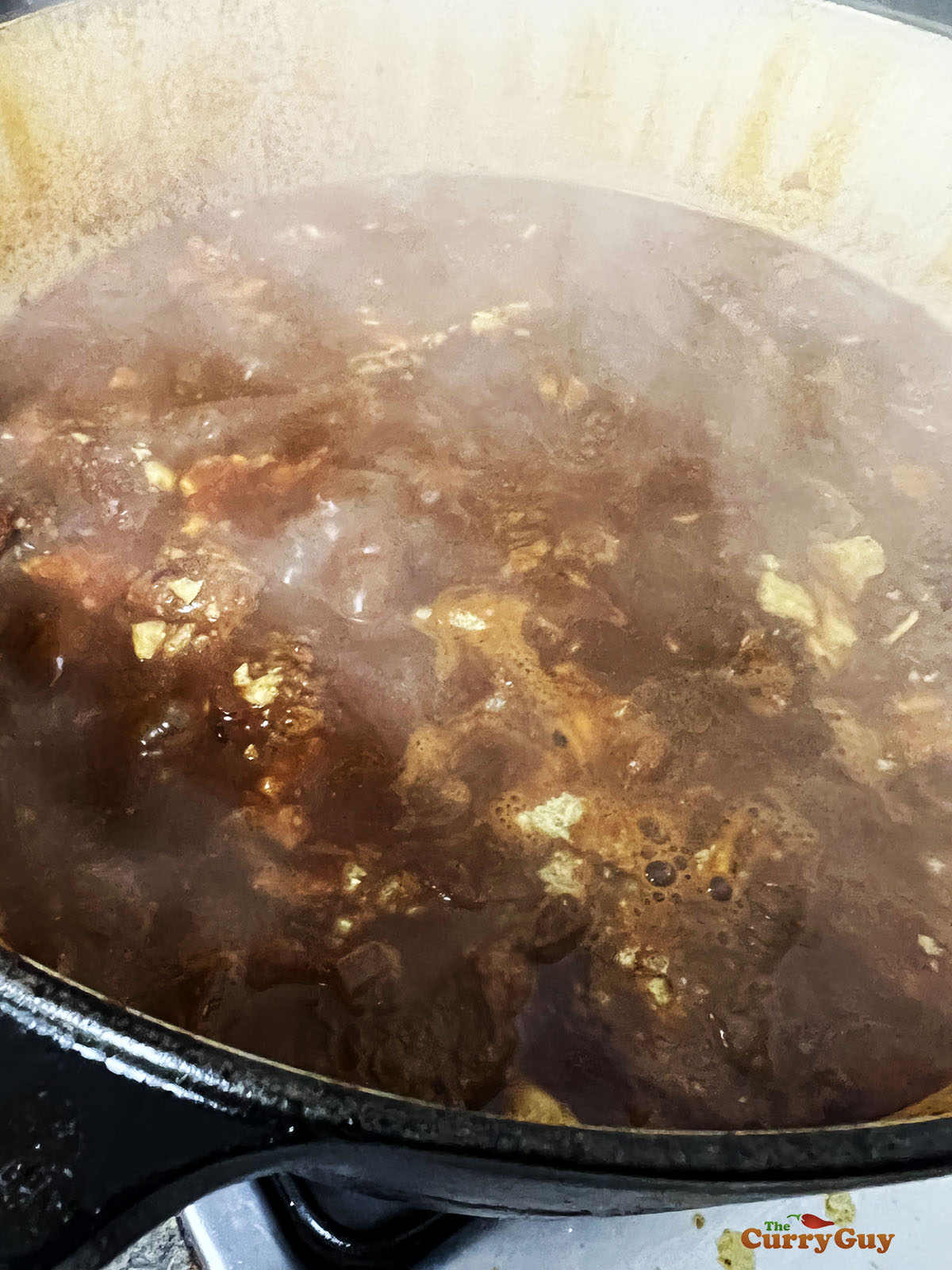 Adding corn chips to the pot.