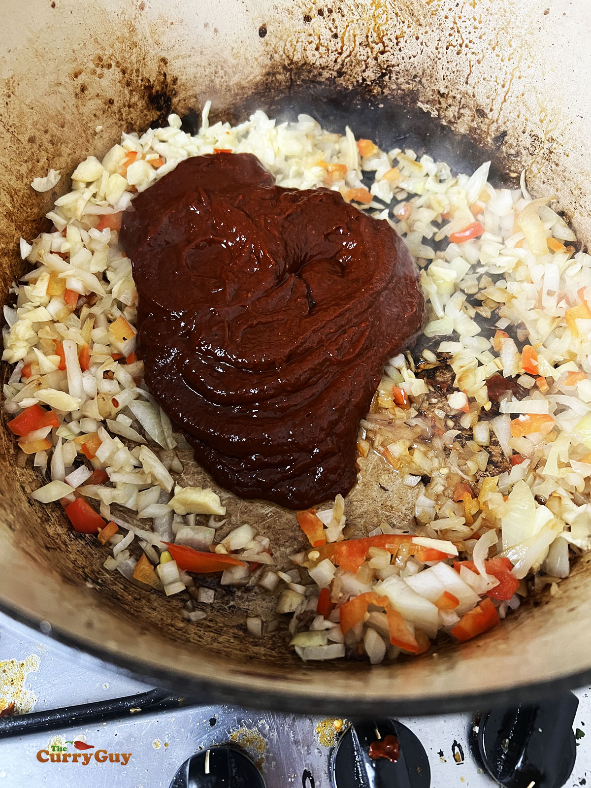 Frying onions, garlic and chili paste