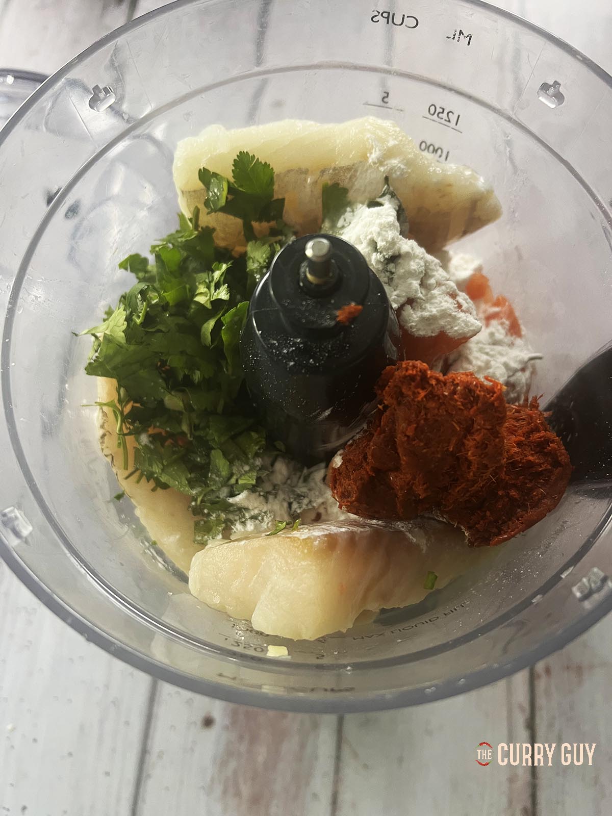 The fish cake ingredients in a food processor.