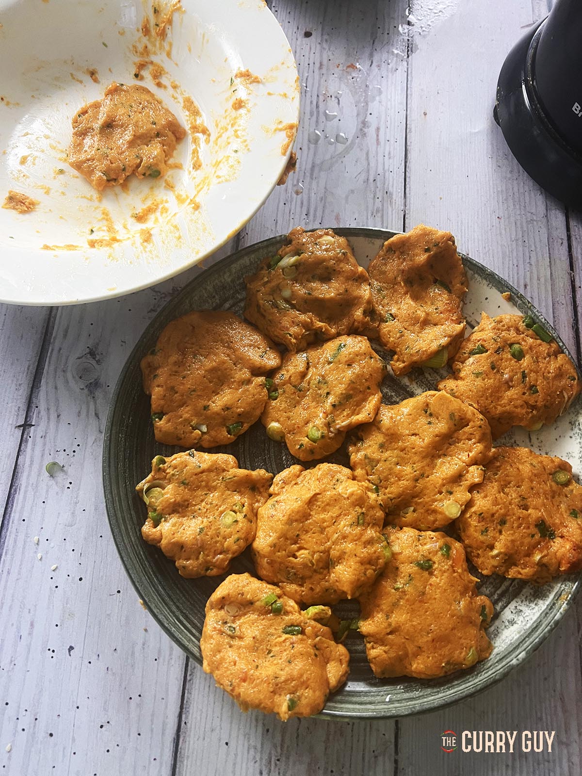 Forming the fish patties before frying.