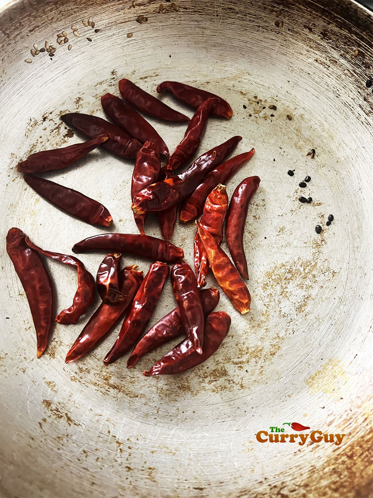Toasting chillies in the pan.