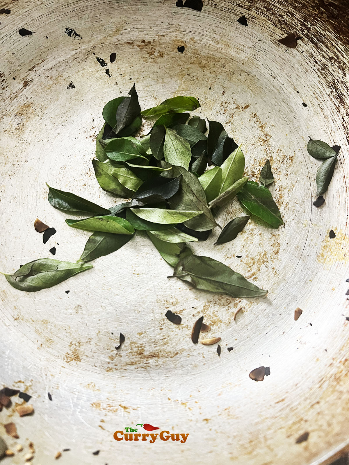 Toasting curry leaves.