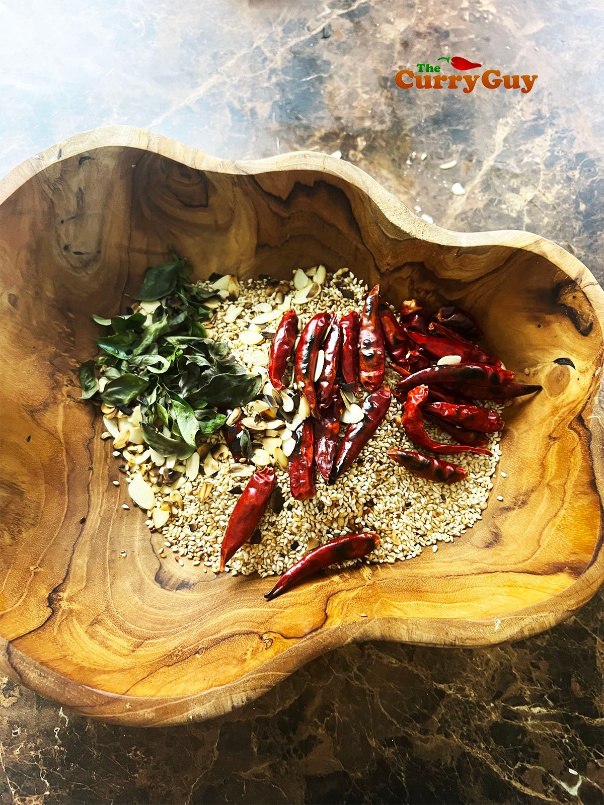 Toasted ingredients cooling in a bowl.
