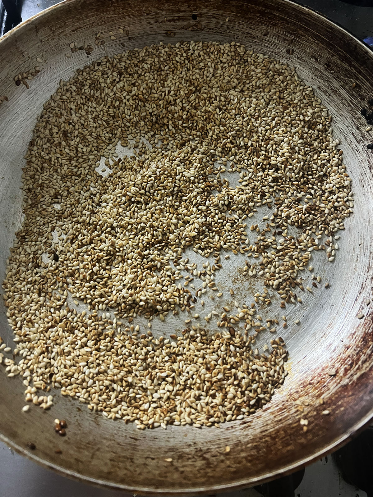 Toasting the sesame seeds.