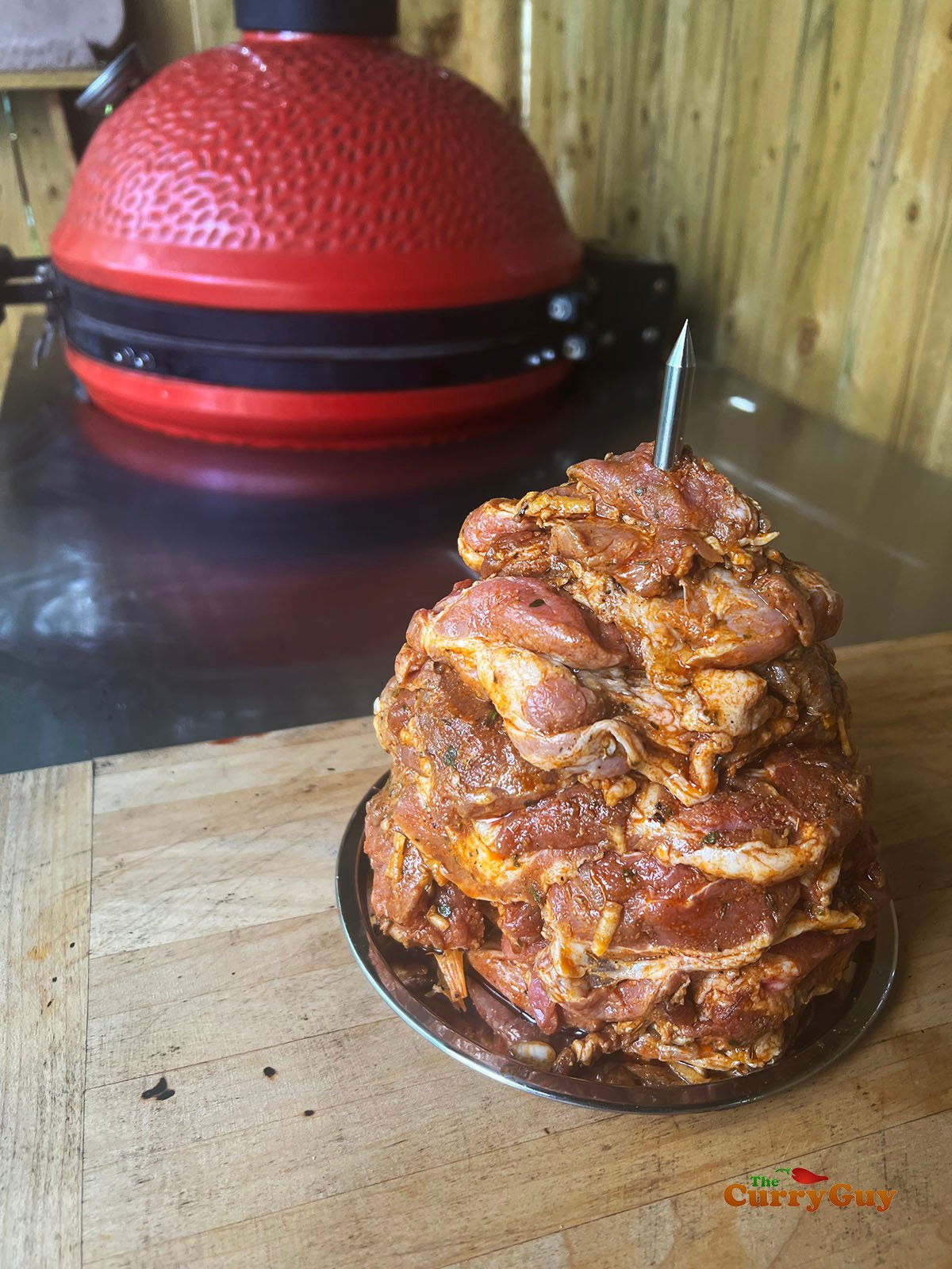Gyro meat threaded on to an upright skewer.
