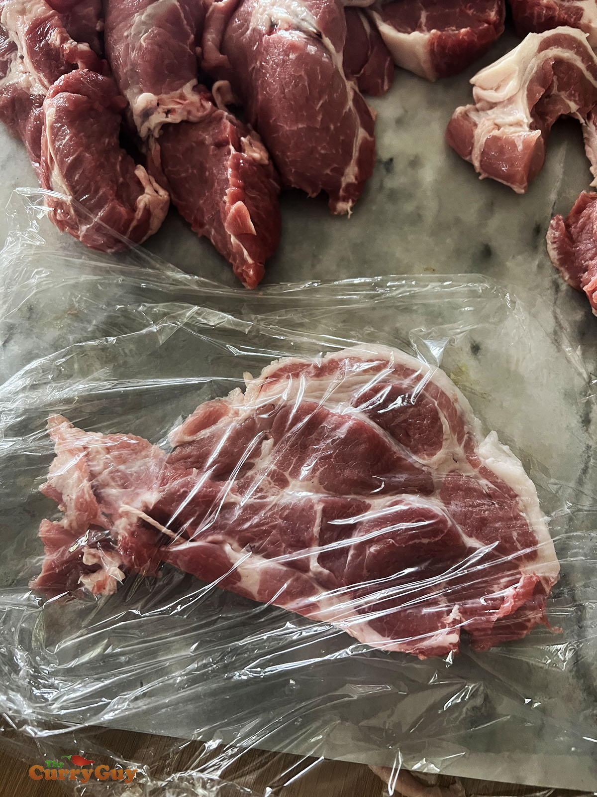 Meat being prepared for tenderising. 