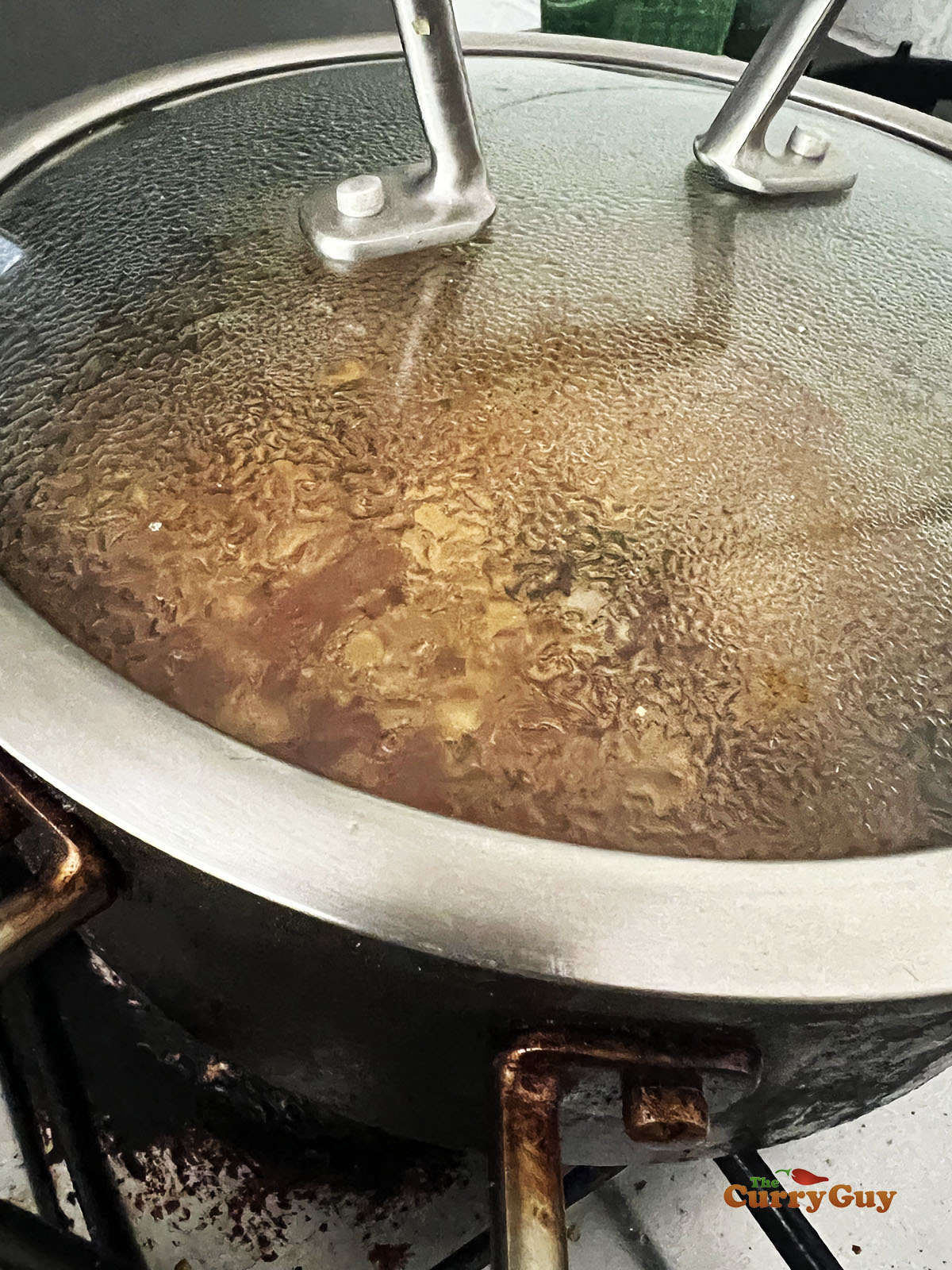Simmering the chicken in the pan