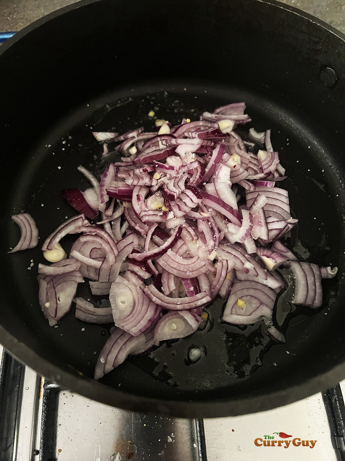 Frying onions in a pan.
