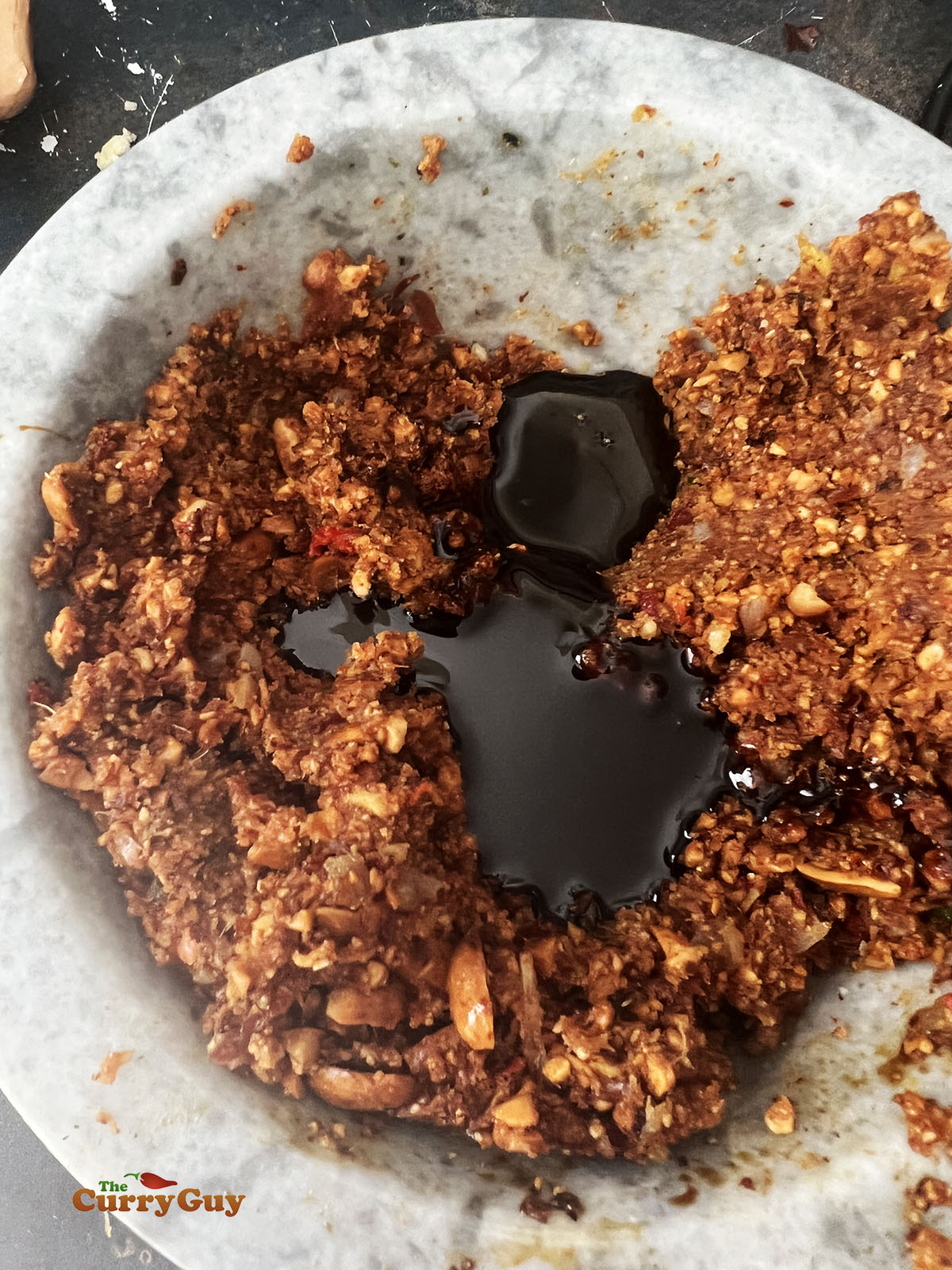 Preparing the peanut sauce.