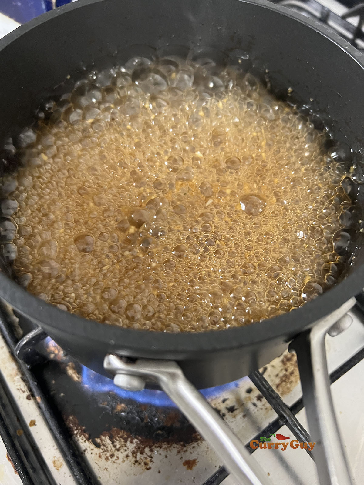 Simmering the yakitori sauce.