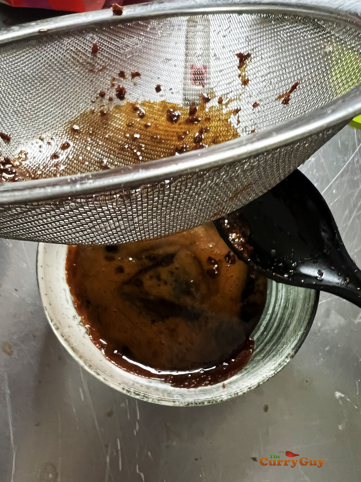 Straining the yakitori sauce