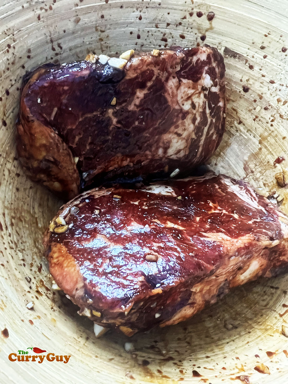 Marinating the steaks.