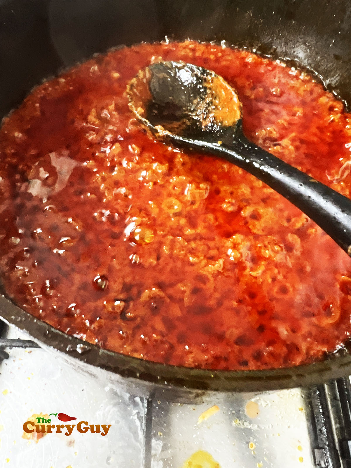 Simmering the changezi gravy.