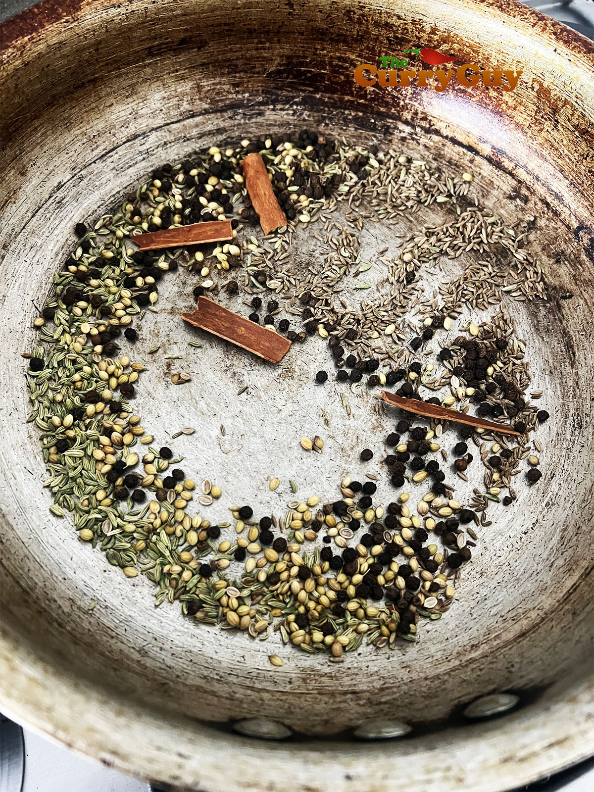 Toasting the whole spices in a frying pan